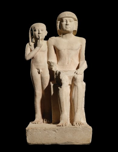 AN EGYPTIAN LIMESTONE GROUP ST