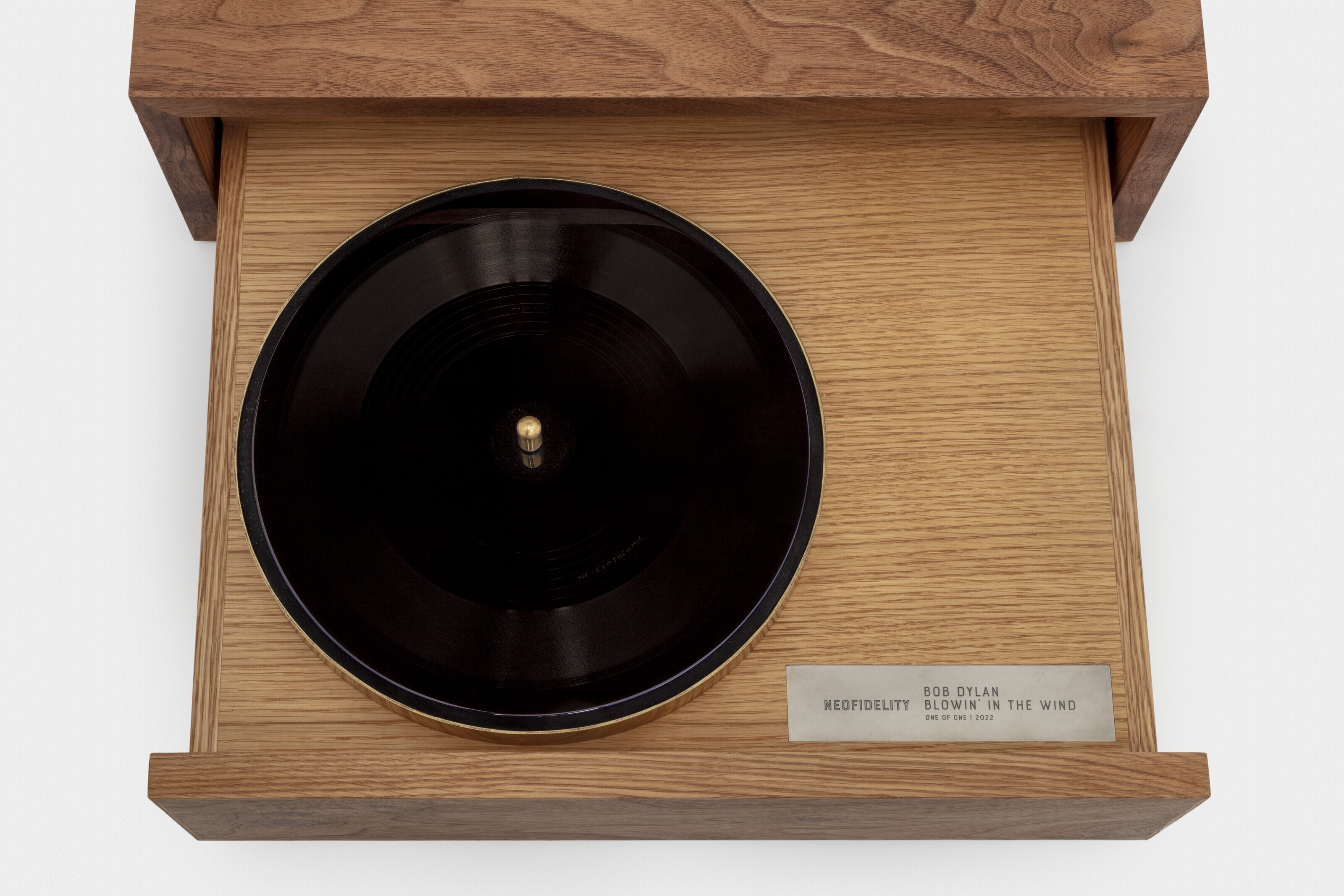 A NeoFidelity Ionic Original acetate disc of a 2021 recording of &lsquo;Blowin&rsquo; in the Wind&rsquo; with custom walnut and white oak cabinet. 10 in diam. (disc); 6&frac14; x 19 x 15&frac34; in (cabinet). Sold for &pound;1,482,000 on 7 July 2022 at Christie&rsquo;s in London