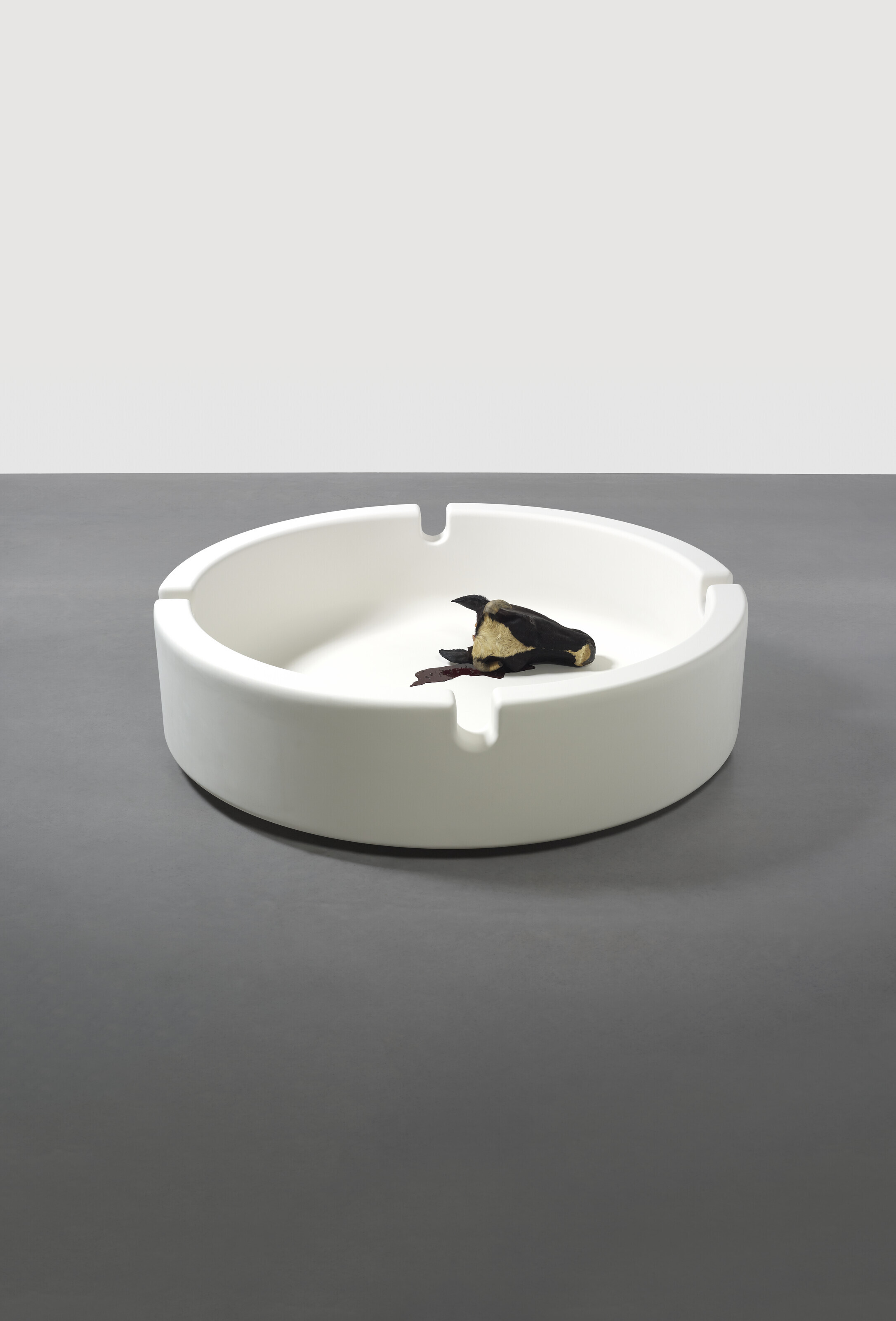 Damien Hirst (b. 1965), Ashtray Head/Fallen Empire, 1995. Fibreglass, cow's head, blood and flies. 26 x 96 x 96 in (65 x 243.8 x 243.8 cm). Sold for £1,002,000 on 1 March 2022 at Christie’s in London