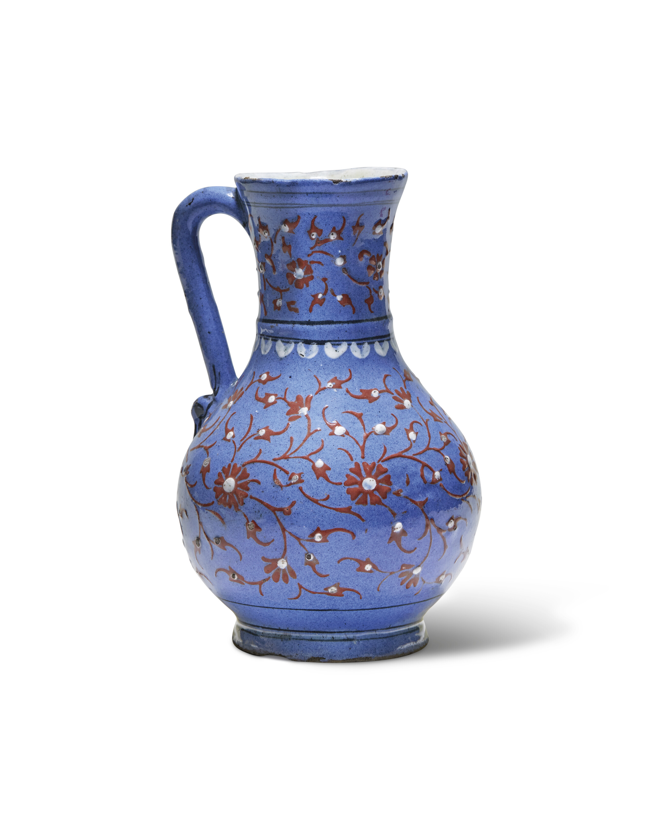 AN IZNIK LAVENDER GROUND SLIP PAINTED POTTERY JUG, OTTOMAN
