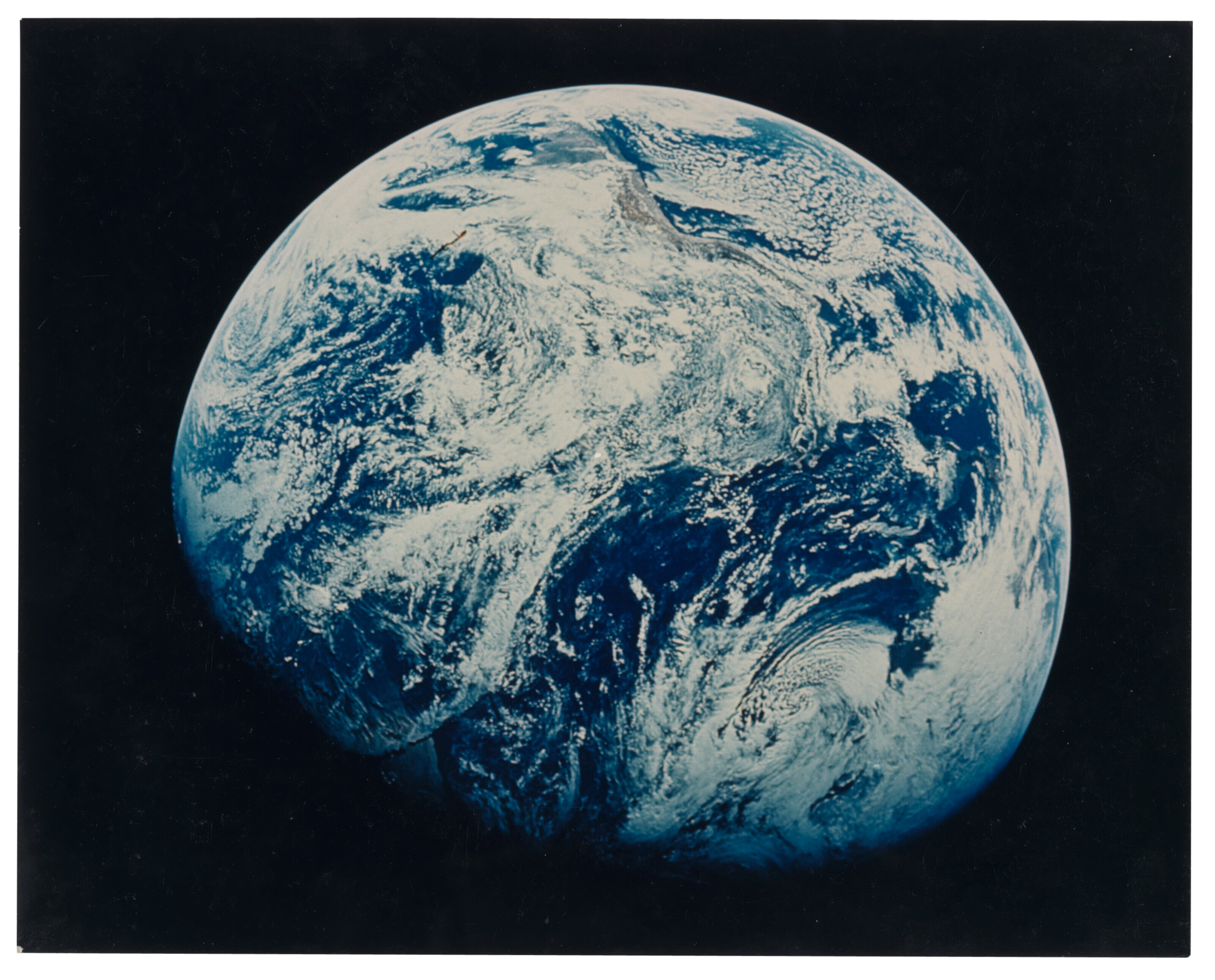 First human-taken photograph of the planet Earth, 21-27 December 1968, William Anders (Apollo 8). 20.3 x 25.4 cm (8 x 10 in). Sold for &pound;10,080 on 18 May 2022 at Christie&rsquo;s Online