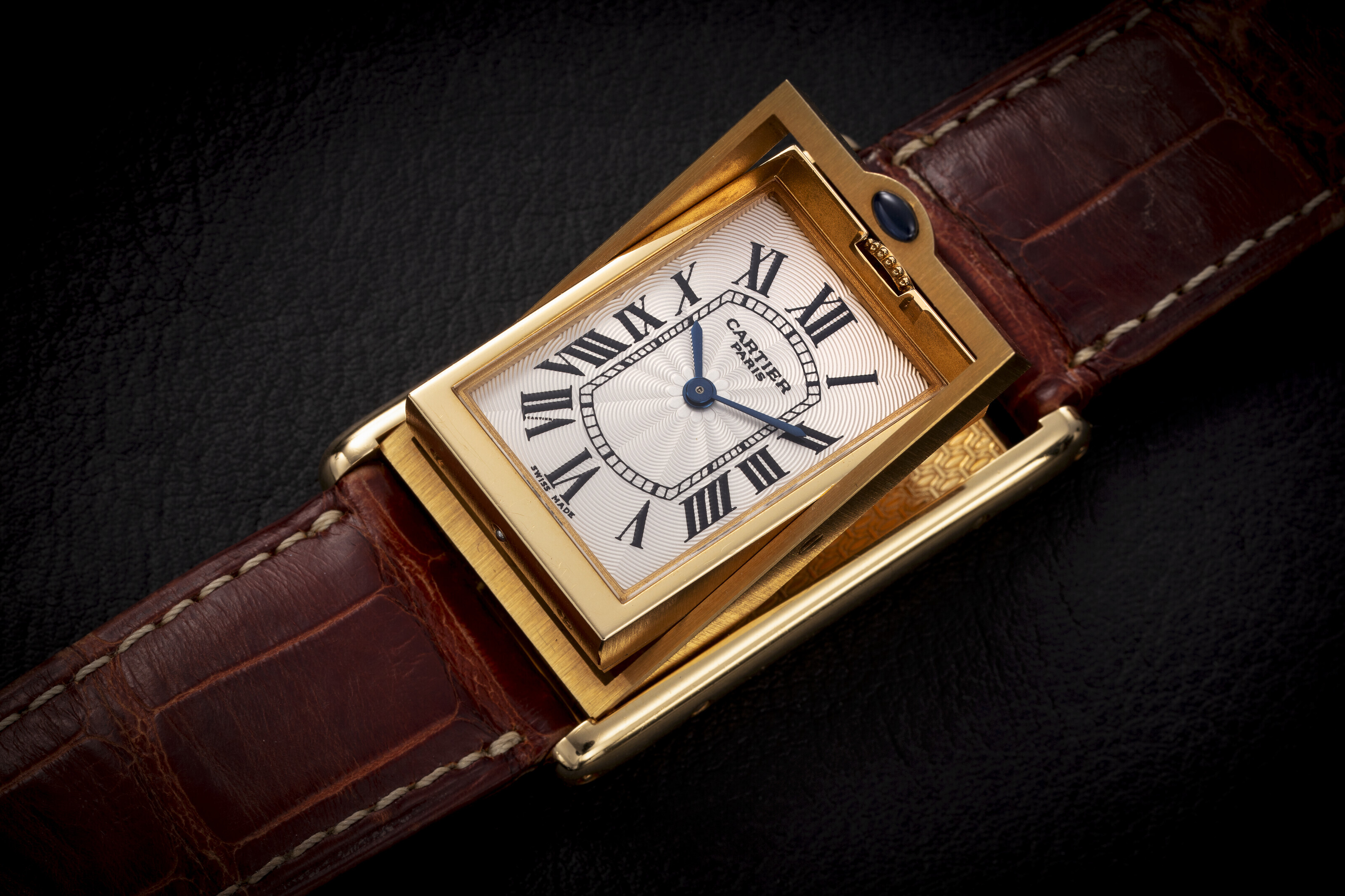 CARTIER, TANK ‘BASCULANTE’ REF. 2499C, A RARE GOLD MANUALWINDING