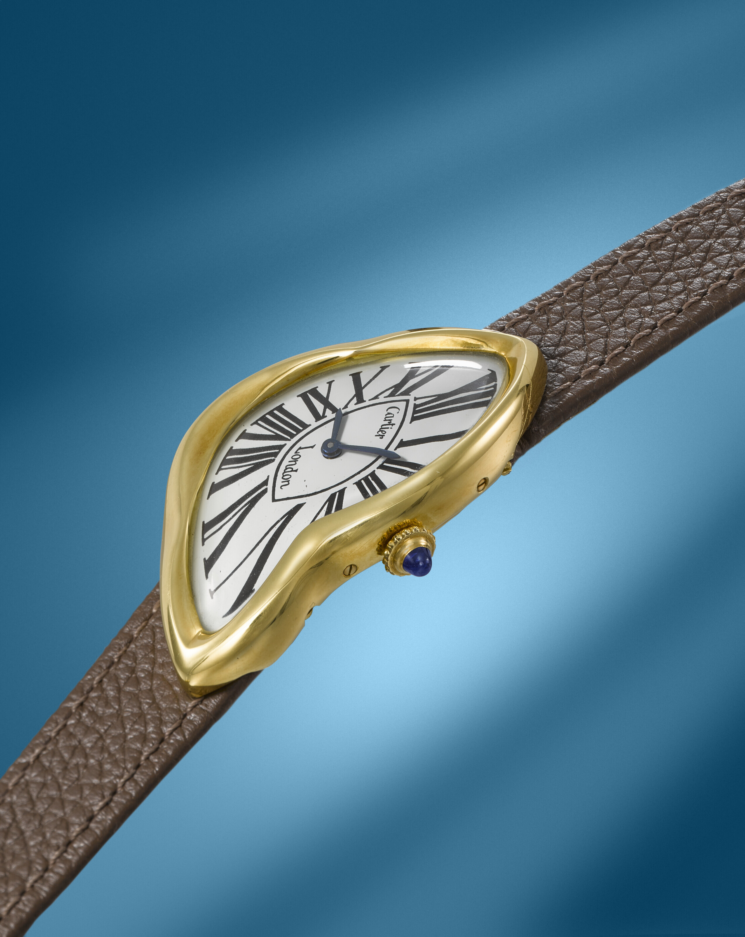 CARTIER. AN EXCEPTIONALLY RARE AND ATTRACTIVE 18K GOLD ASYMMETRIC
