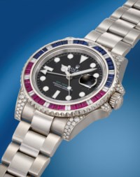 ROLEX. A RARE AND ATTRACTIVE 18K WHITE GOLD, DIAMOND, RUBY AND SAPPHIRE ...