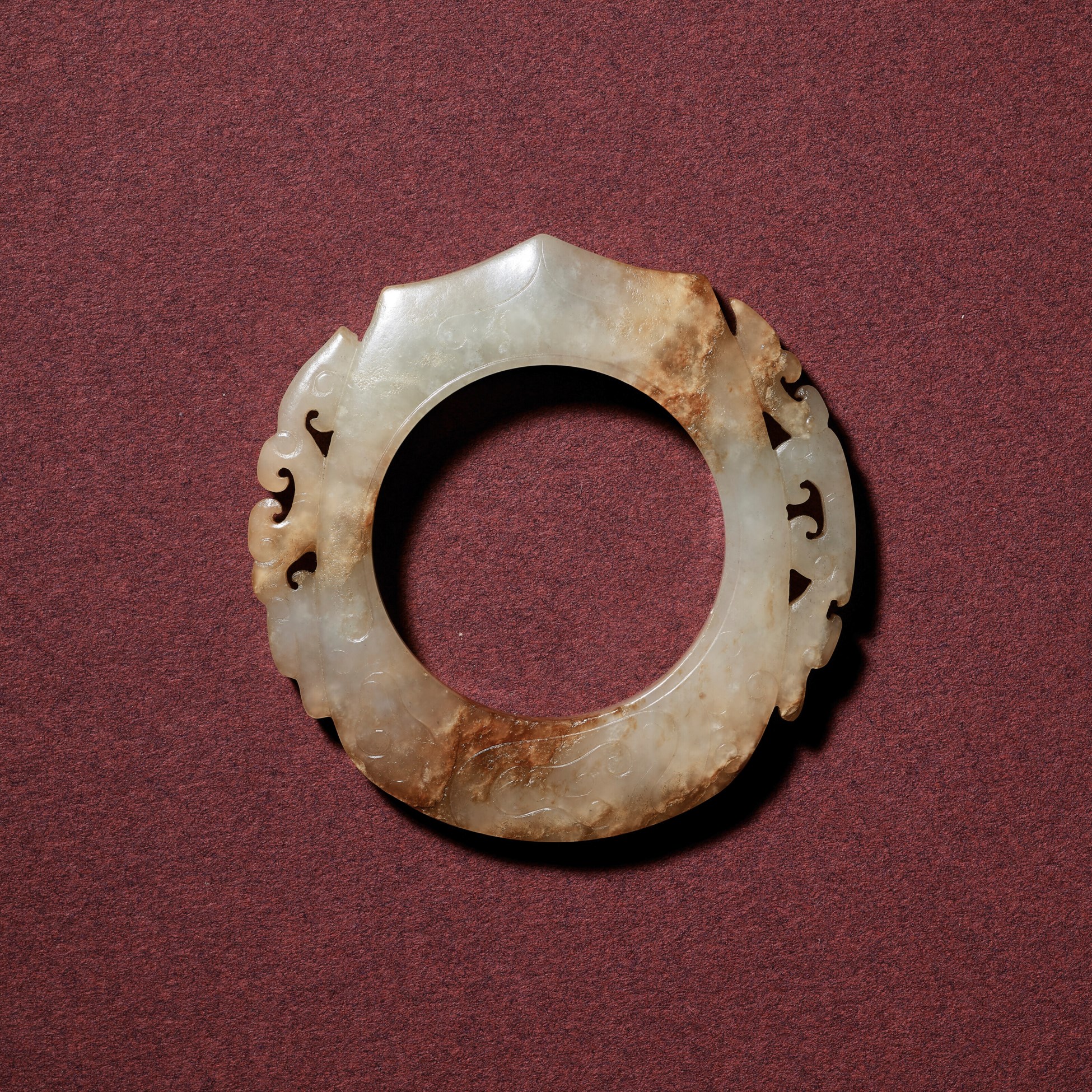 A WHITE JADE RETICULATED ARCHER’S RING, SHE, WESTERN HAN DYNASTY (206