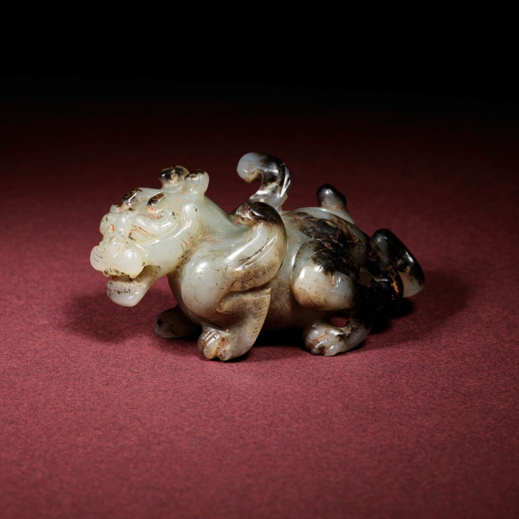 AN EXCEEDINGLY RARE AND EXCEPTIONAL JADE CARVING OF A MYTHICAL BEAST ...