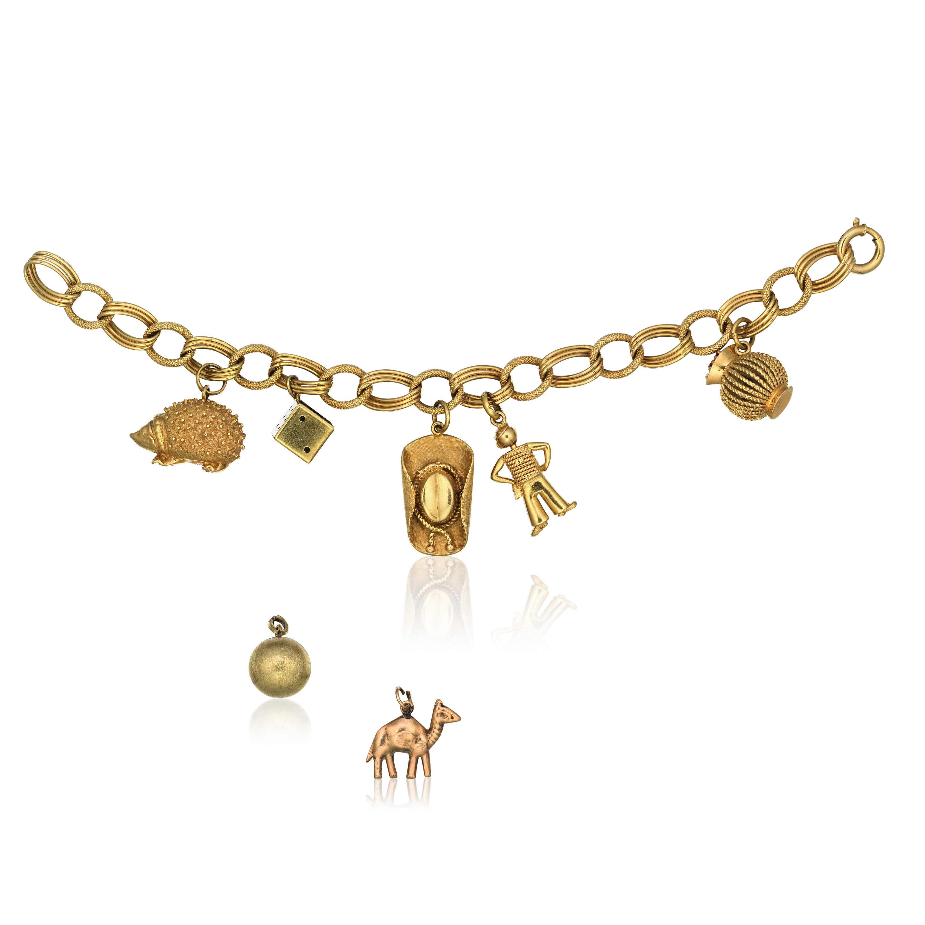 GOLD AND RUBY CHARM BRACELET, Christie’s