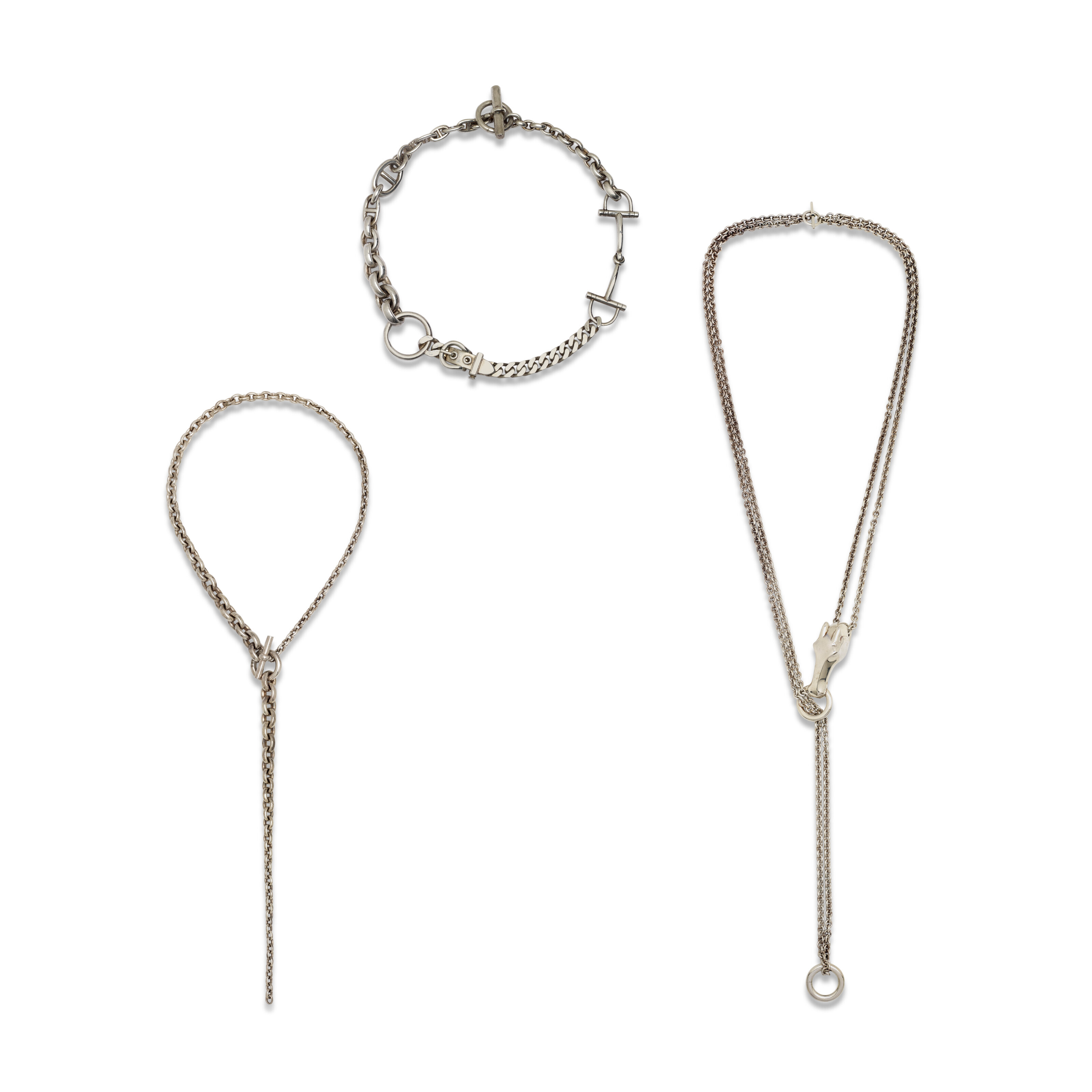 A SET OF THREE: A SILVER MEDIUM GALOP NECKLACE, A SILVER PÊLE MÊLE