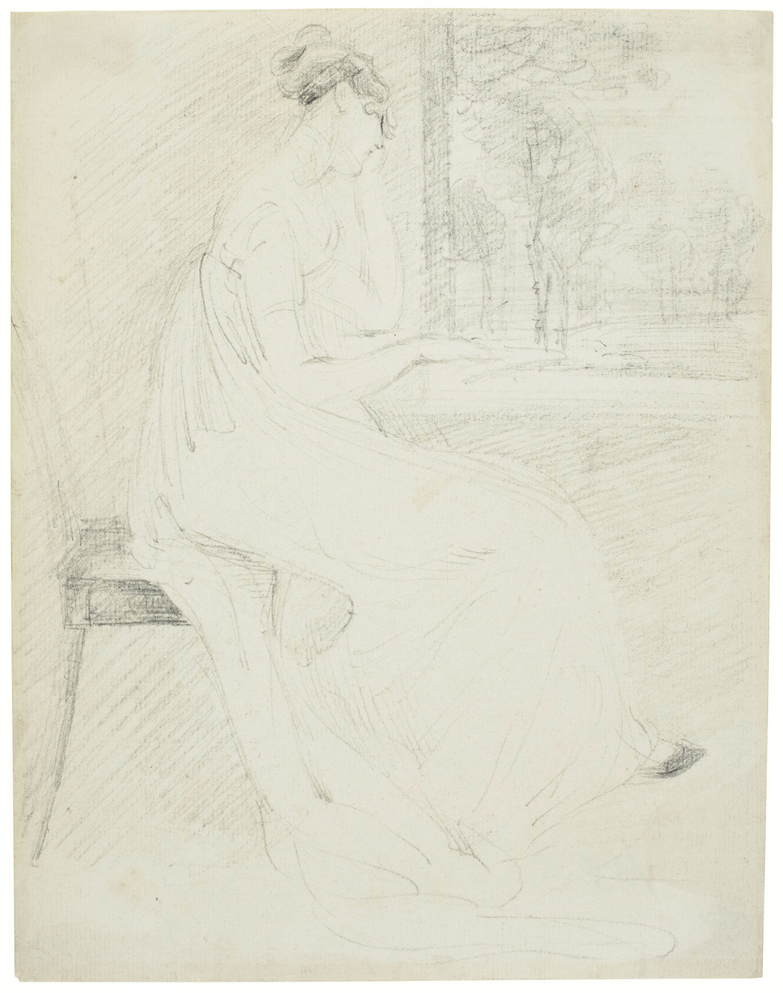 A young woman reading at a window