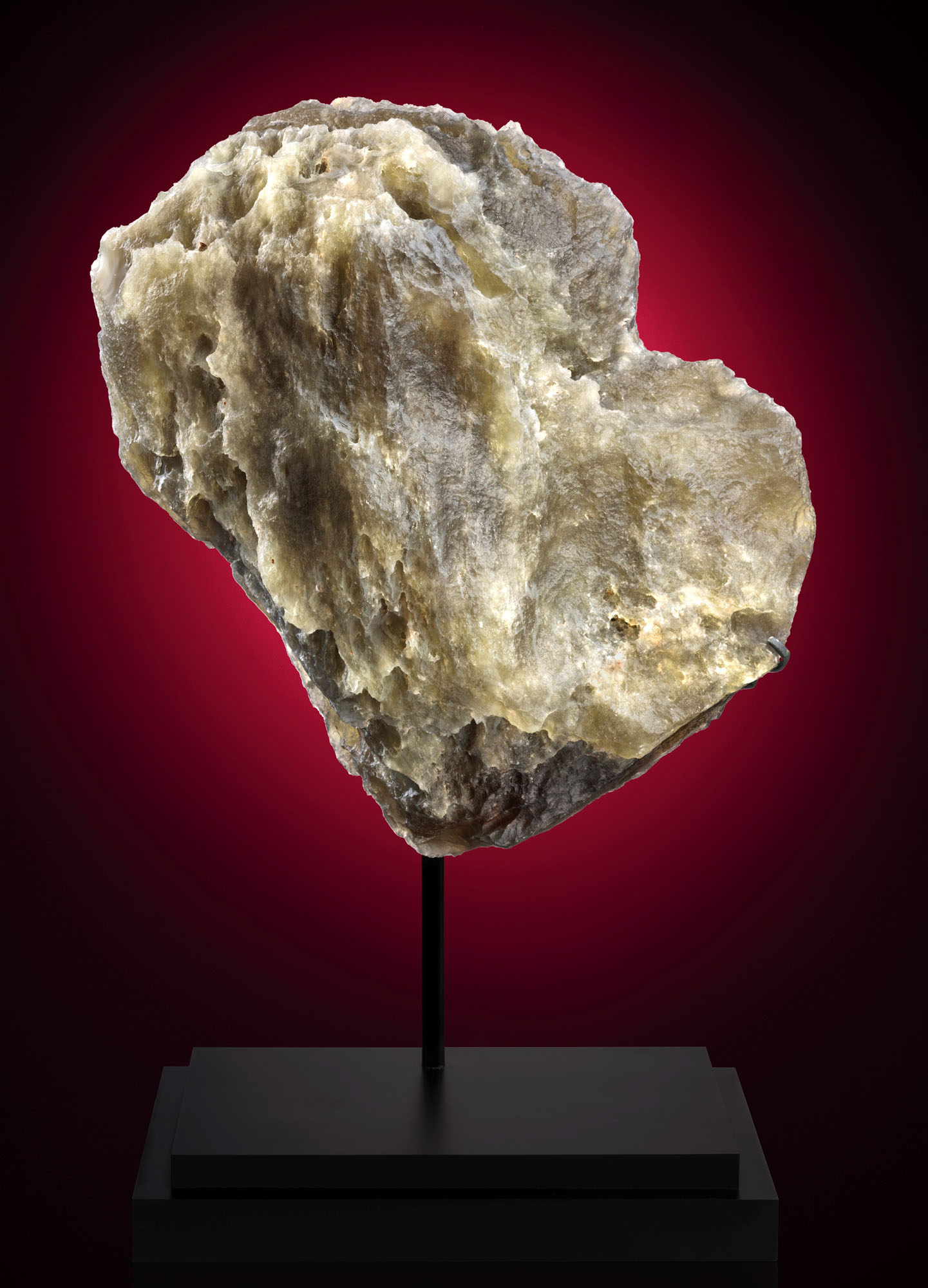 Desert glass from an asteroid impact &mdash; the largest specimen known to exist. 16.75 x 14.25 x 9.25 in (425 x 360 x 235mm) and 58.25 lbs  (26.445 kg)