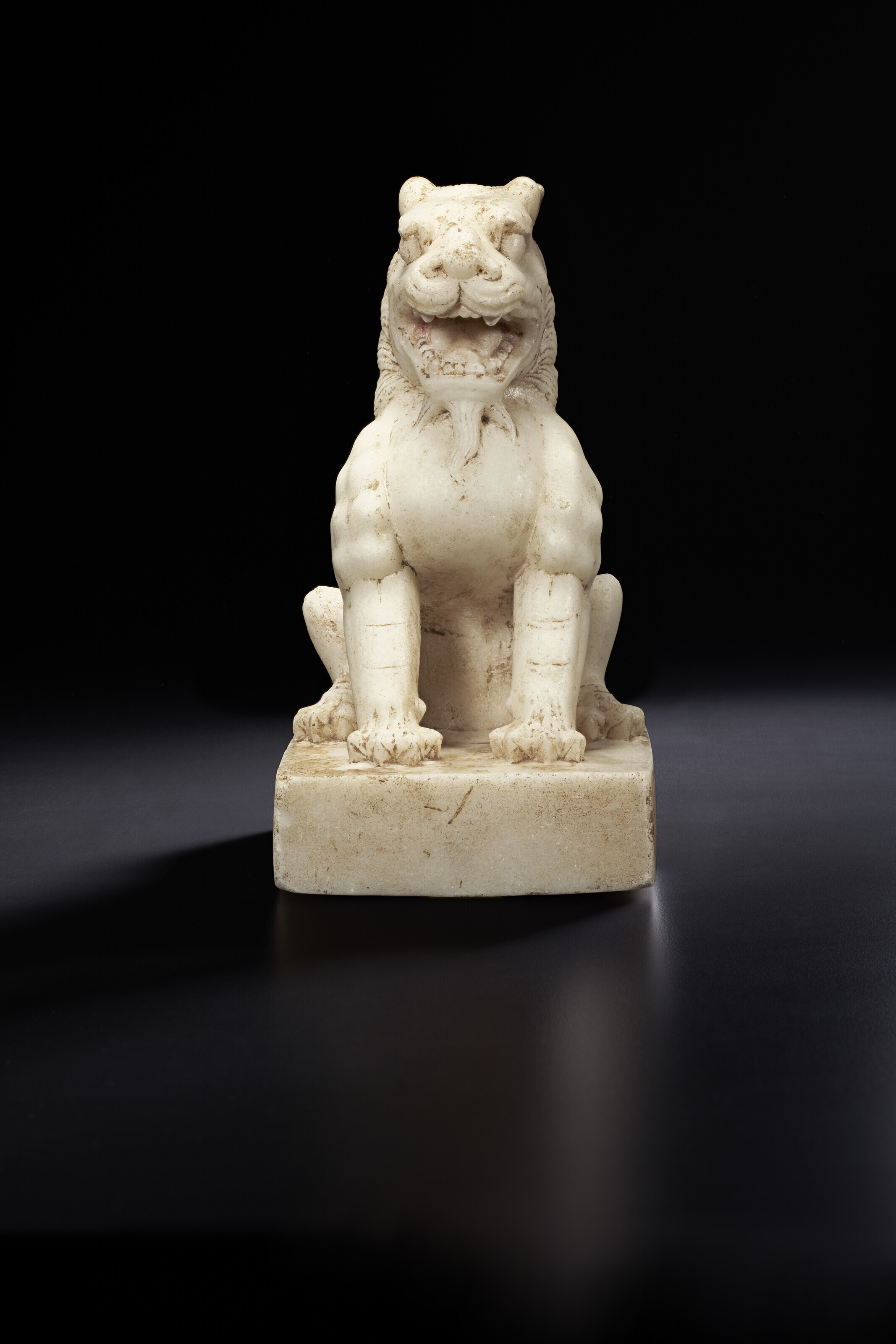 A SUPERB CARVED WHITE MARBLE FIGURE OF A LION, TANG DYNASTY