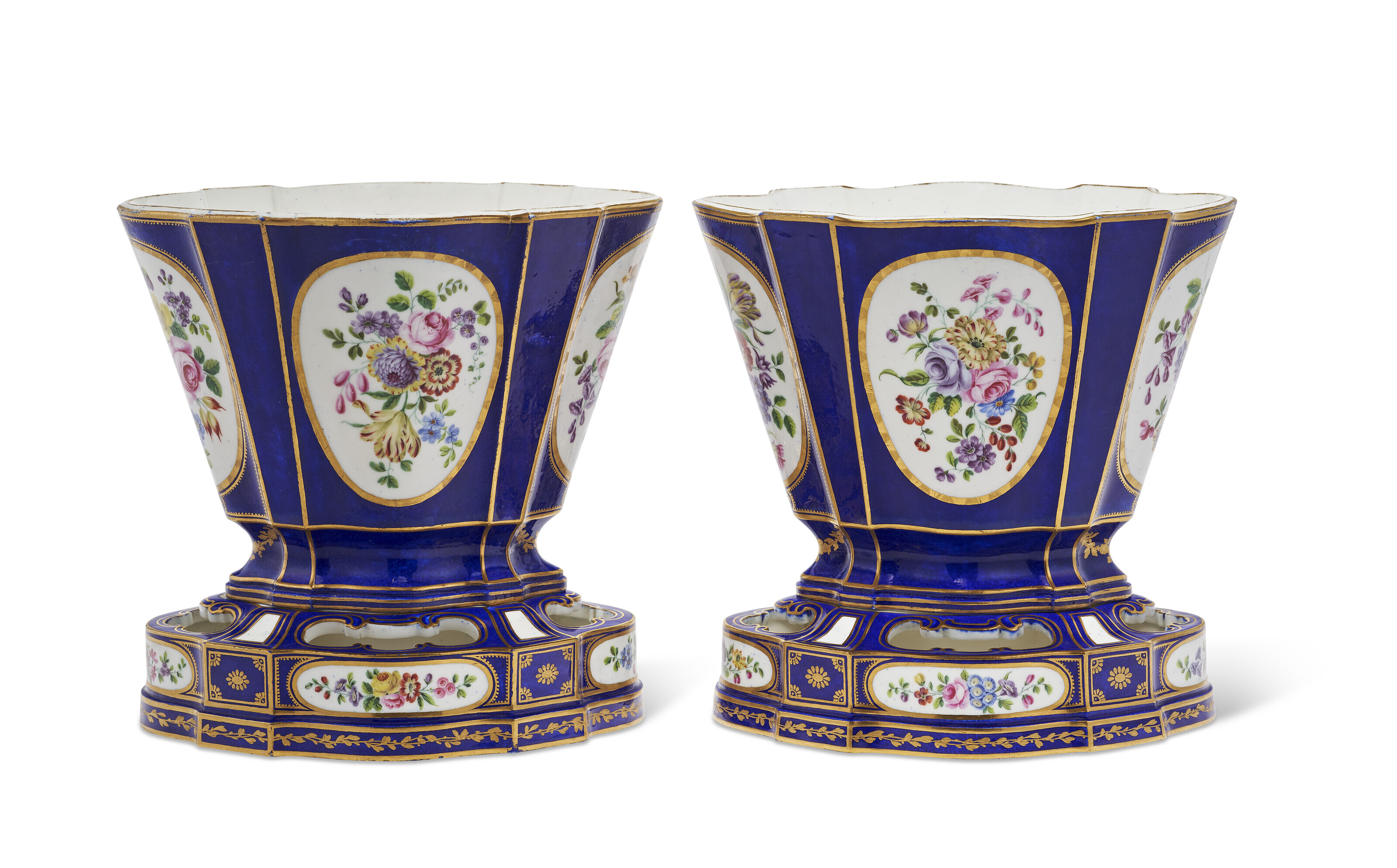 A PAIR OF SEVRES PORCELAIN 'BLEU NOUVEAU' VASES AND STANDS