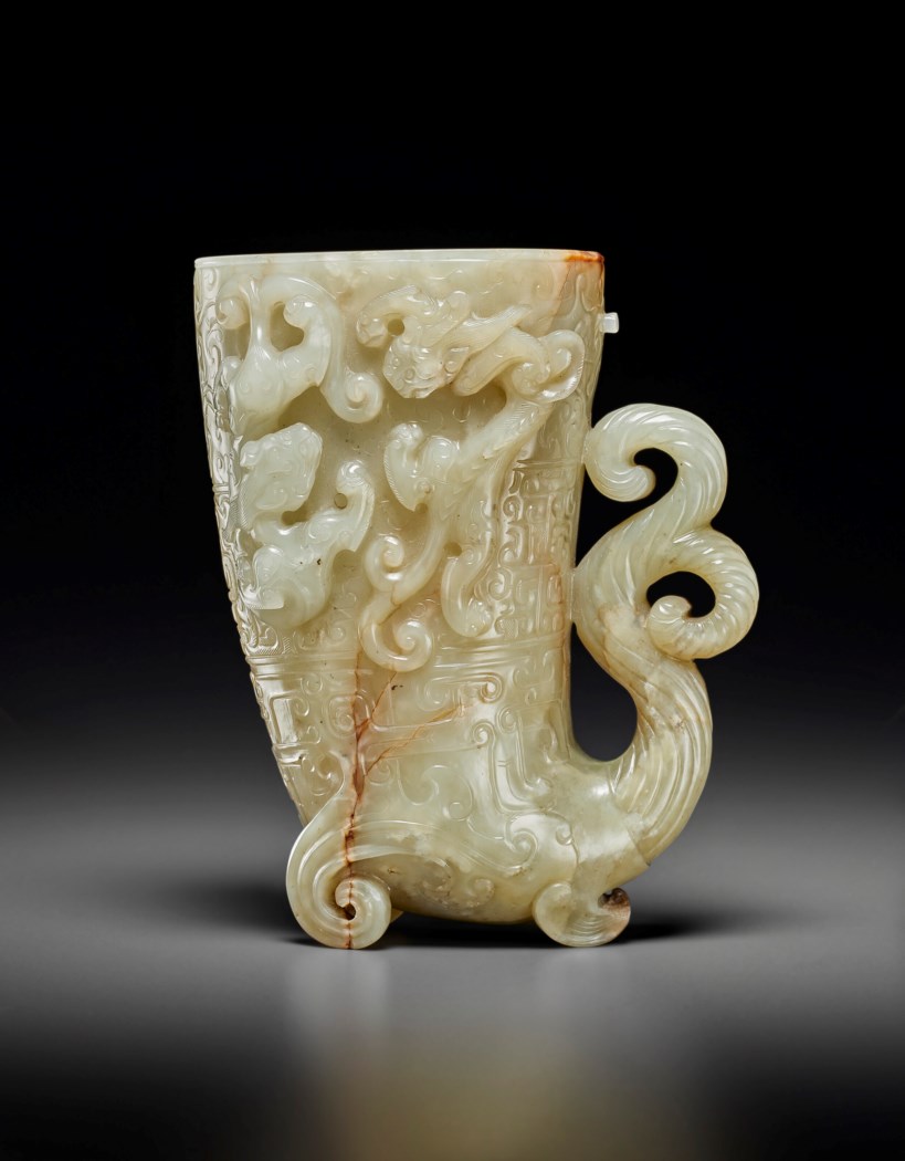 A FINELY CARVED PALE GREYISH-WHITE JADE RHYTON, GONG, LATE MING-QING ...