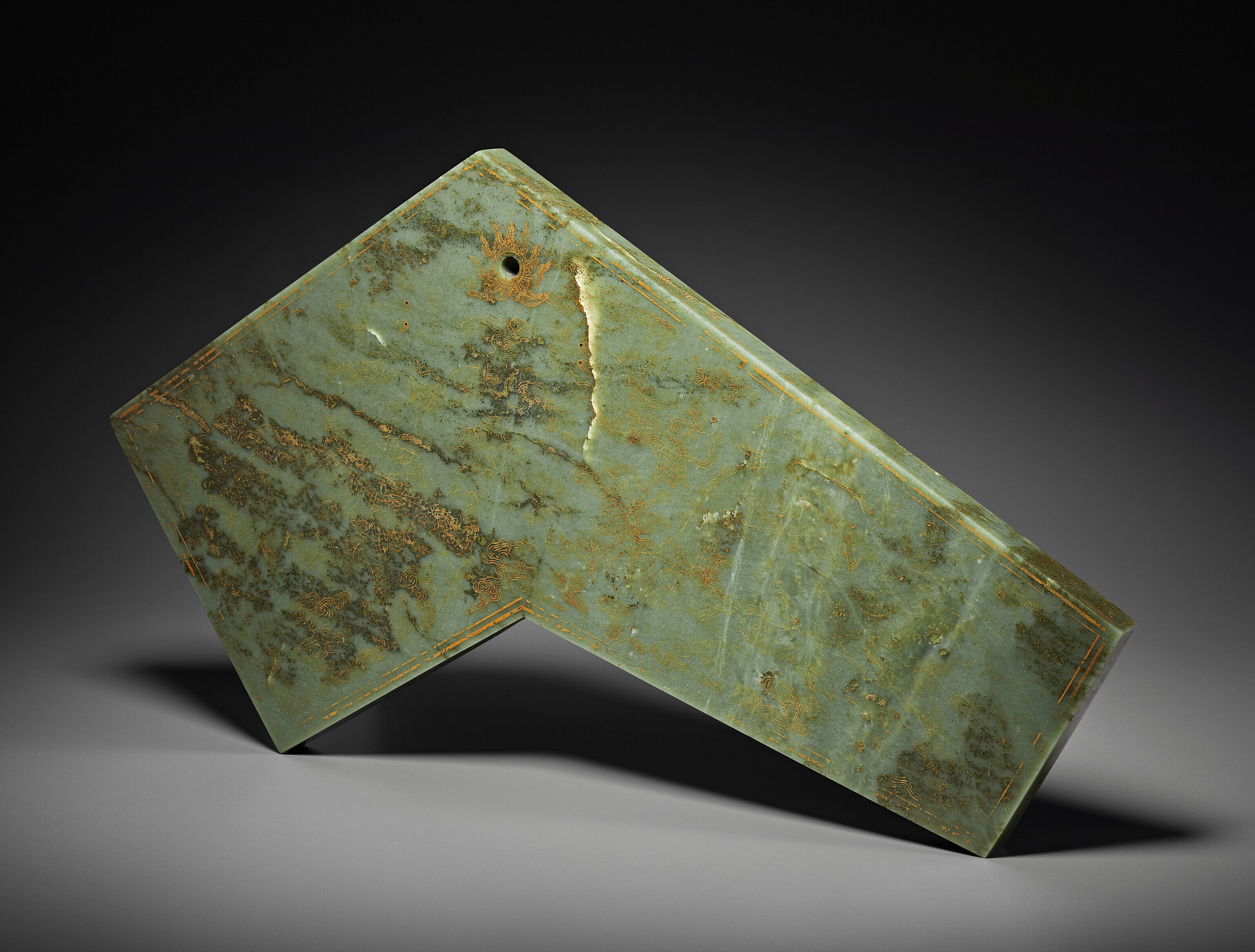 A MUGHAL CARVED GREENISH-WHITE JADE DAGGER HANDLE, THE JADE HANDLE