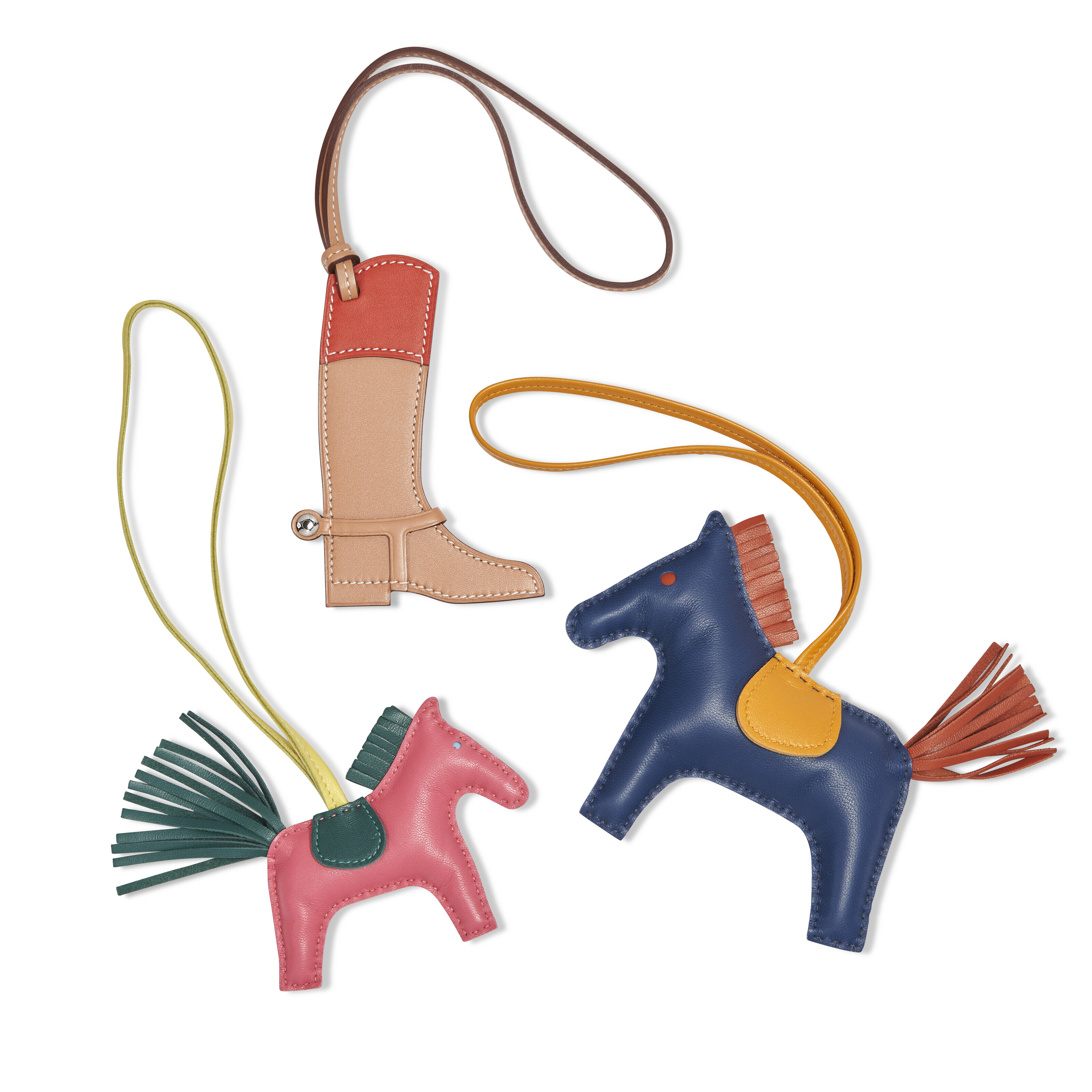 SET OF THREE A PAIR OF GRIGRI RODEO CHARMS & A PADDOCK BOOT CHARM, HERMÈS, 2020 Christie’s