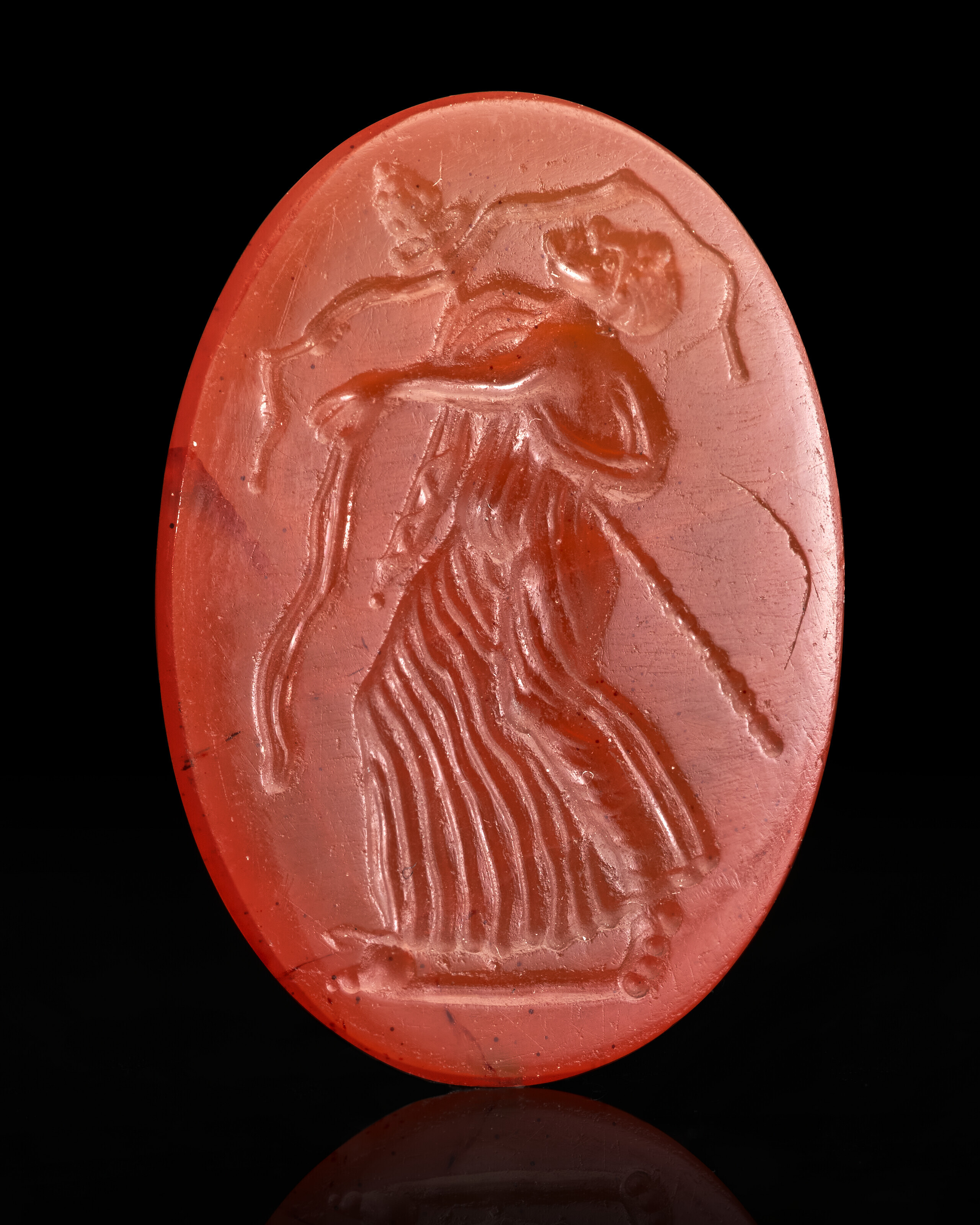 A ROMAN CARNELIAN RINGSTONE WITH A DANCING MAENAD, REPUBLICAN