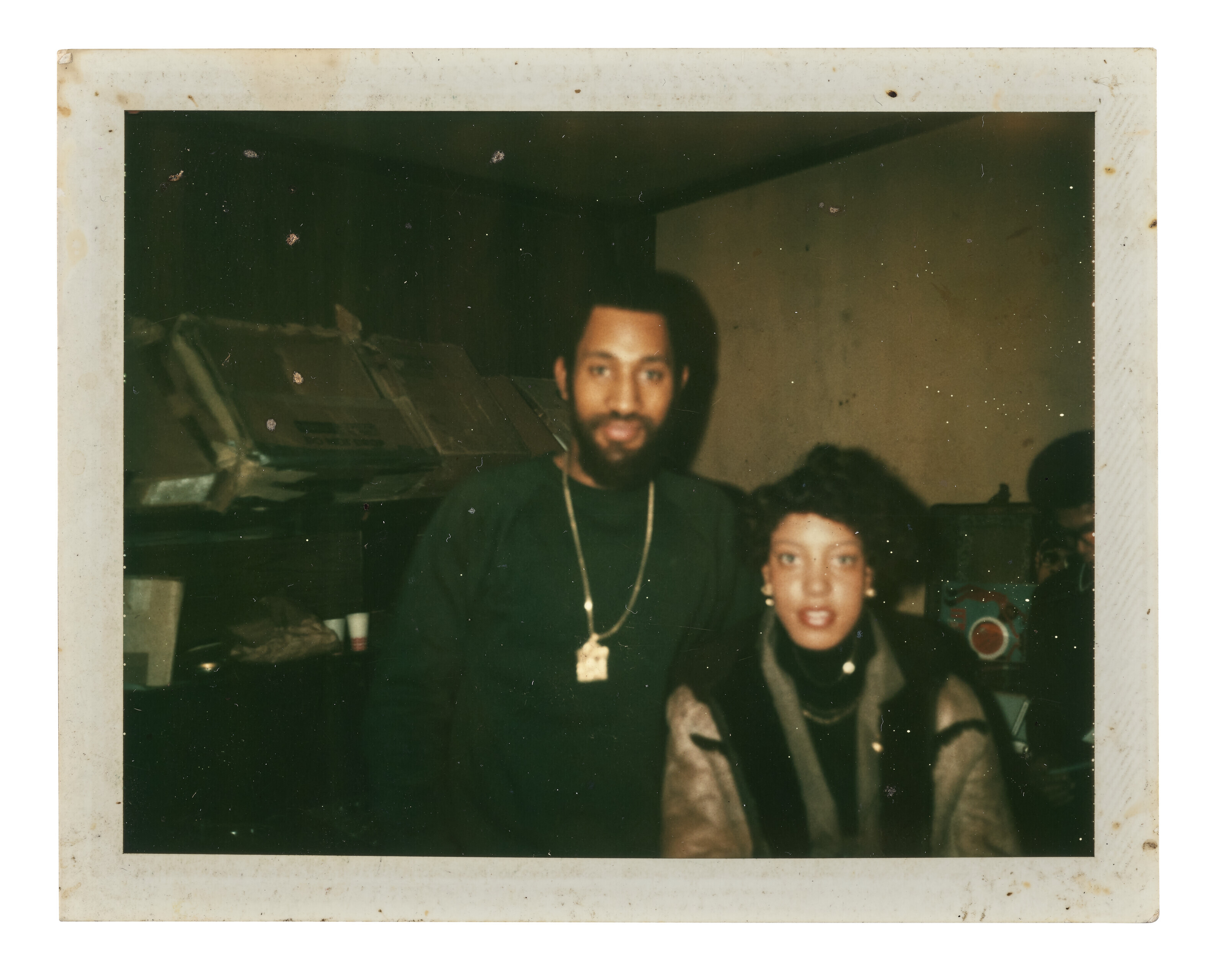 TWO POLAROID PORTRAITS OF DJ KOOL HERC AND DEEDA GREEN: ONE AT