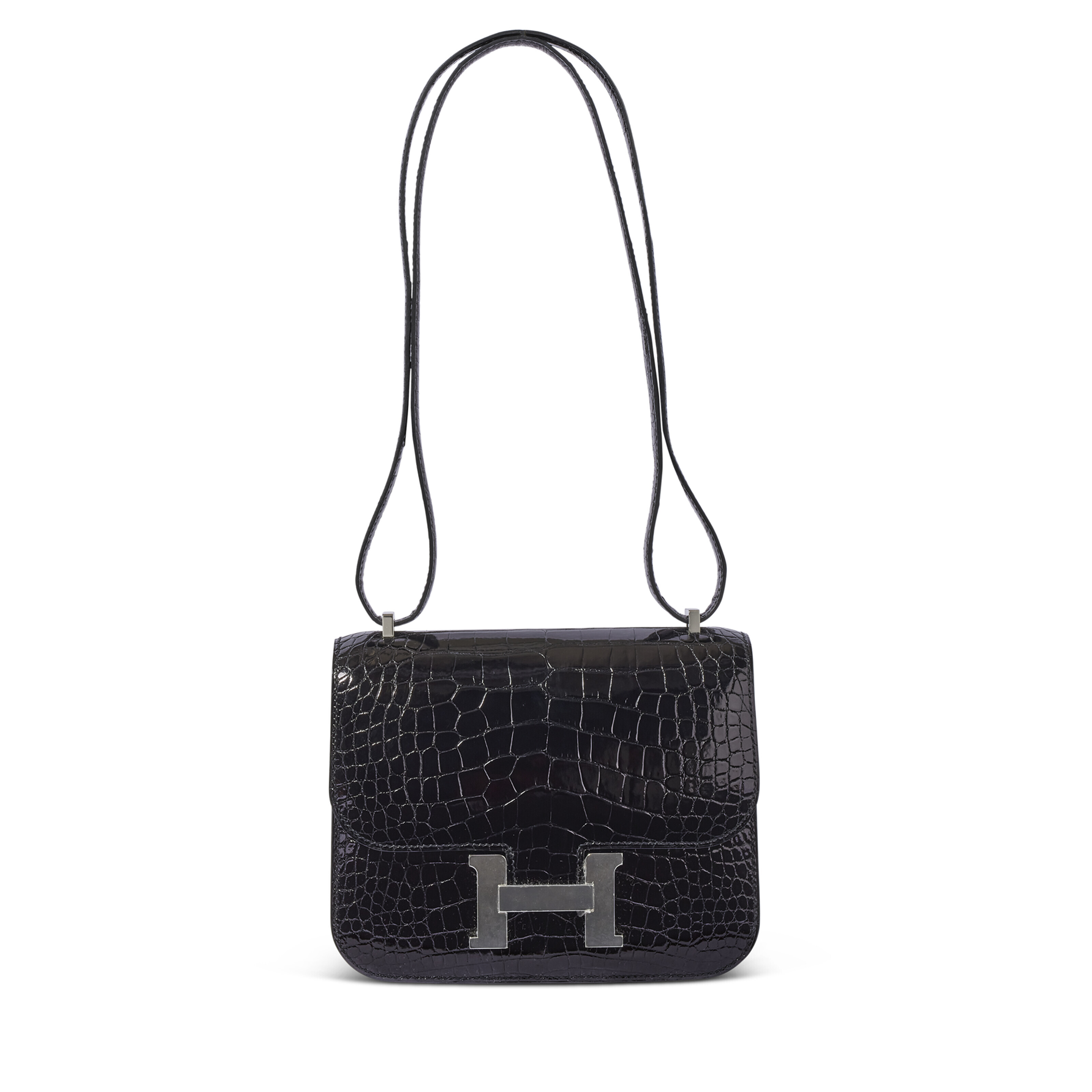 A SHINY BLACK ALLIGATOR MINI CONSTANCE 18 WITH PALLADIUM HARDWARE, HERMÈS, 2020 Christie’s