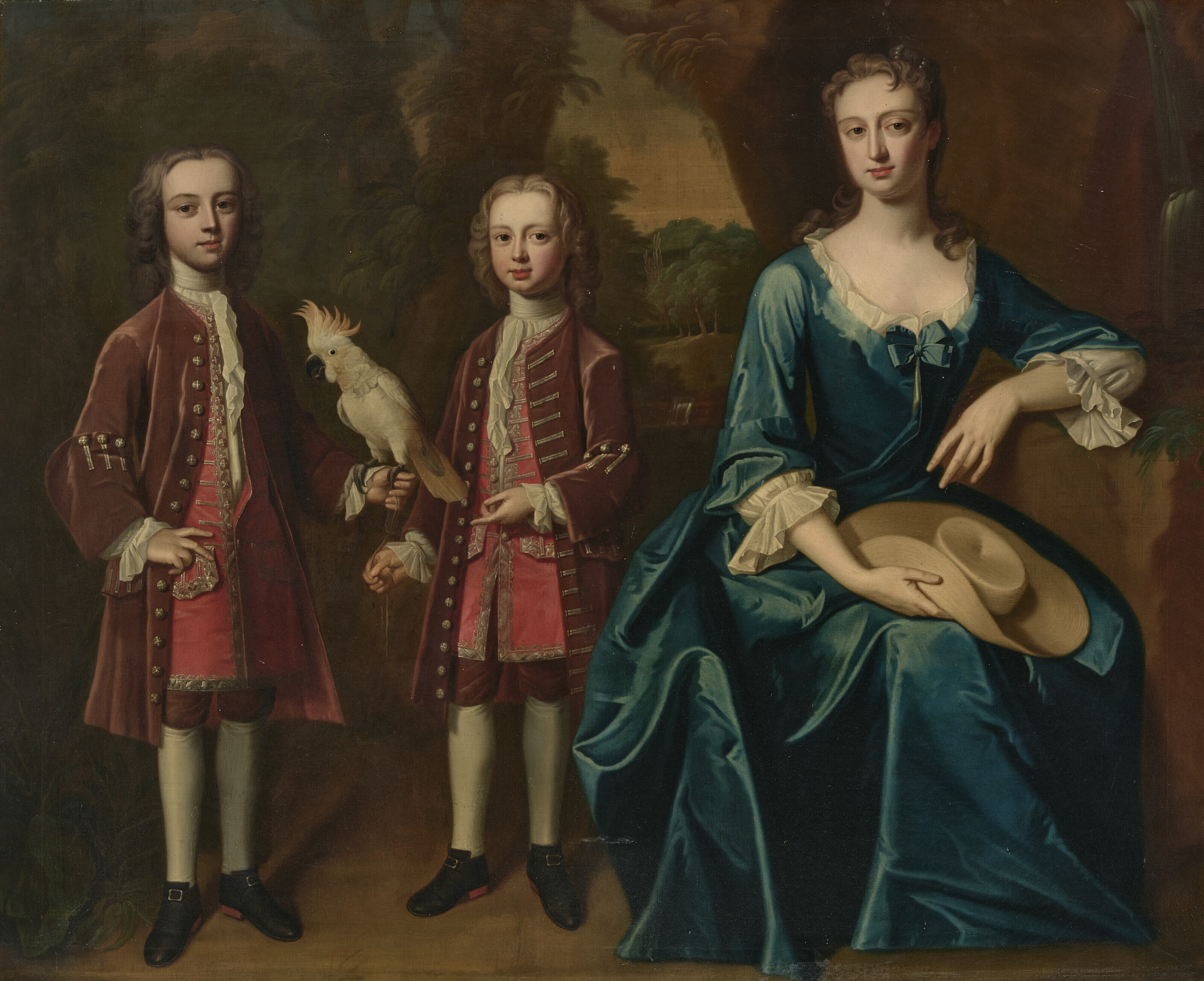 Enoch Seeman, Group portrait of Letitia, Lady Sandys, nee Tipping with her two eldest sons, Edwin, later 2nd Baron Sandys, with a cockatoo in his left hand, and Cheke Sandys (1727-1737), in brown coats and breeches with red waistcoats, offered in Ombersley Court: The Collection of Lord and Lady Sandys on 29 November 2023 at Christie's in London