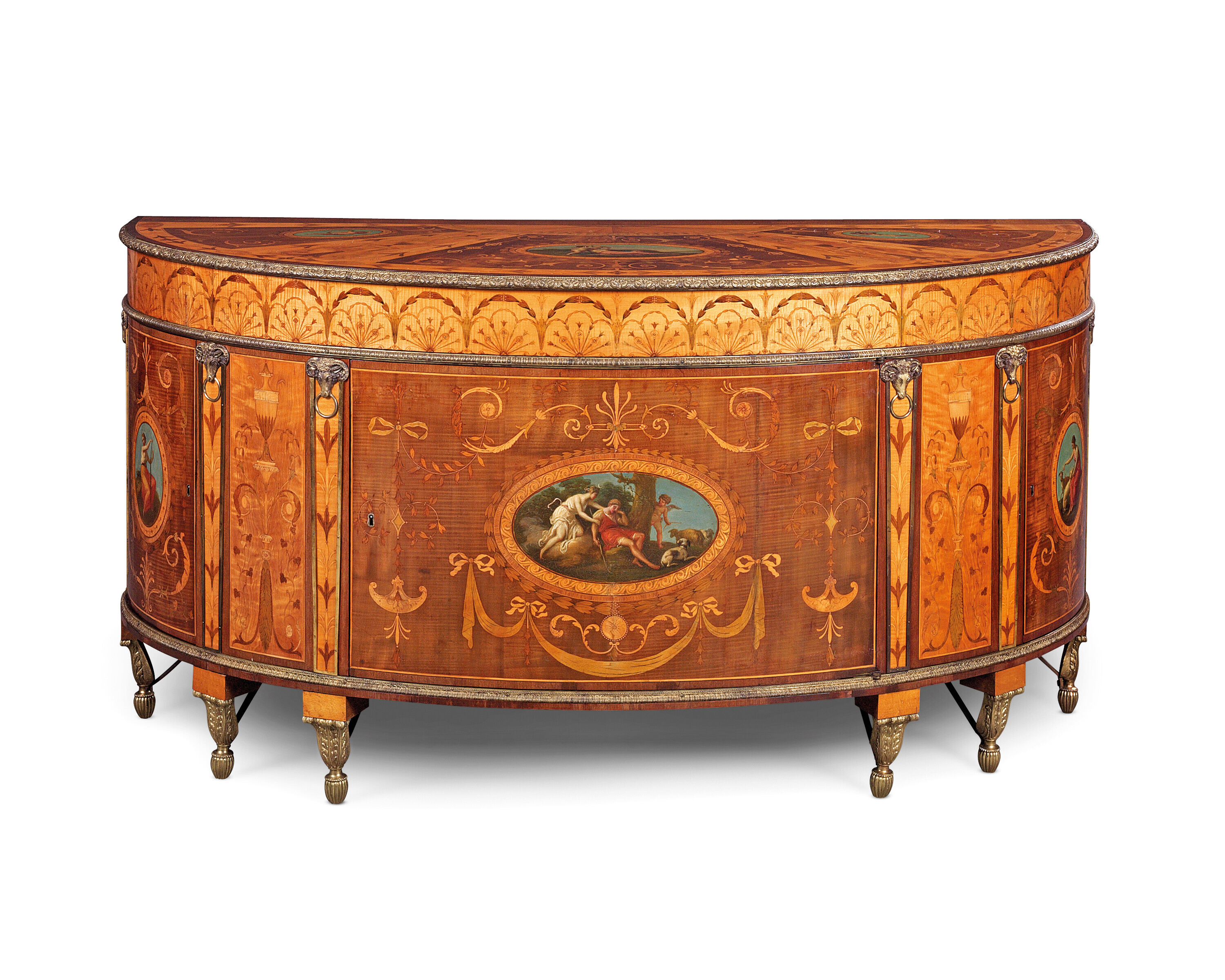 A George III ormolu-mounted and polychrome-decorated satinwood, harewood and marquetry semi-elliptical commode. Attributed to William Ince and John Mayhew, circa 1785. 72&frac12; in (184 cm) wide; 36&frac34; in (93.5 cm) high; 29&frac14; in (74 cm) deep. Sold for &pound;340,200 on 6 July 2023 at Christie&rsquo;s in London