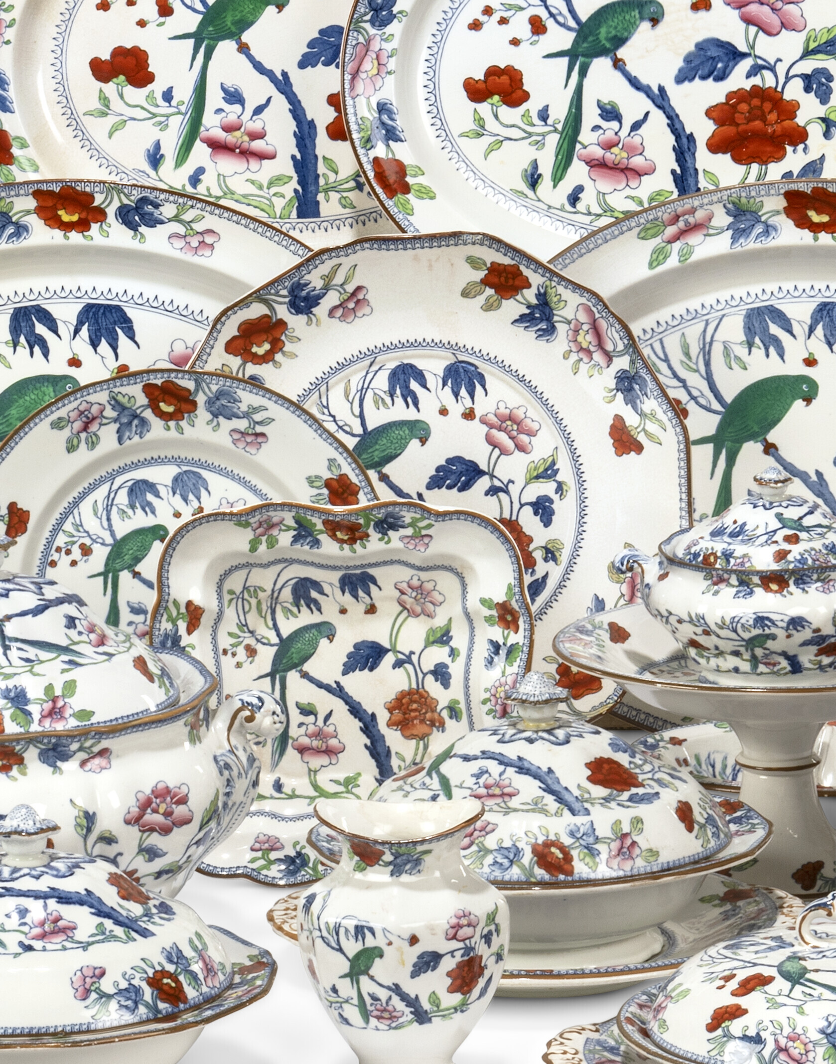 A BOOTHS SILICON CHINA 'GREEN PARROT' PATTERN COMPOSITE PART TABLE