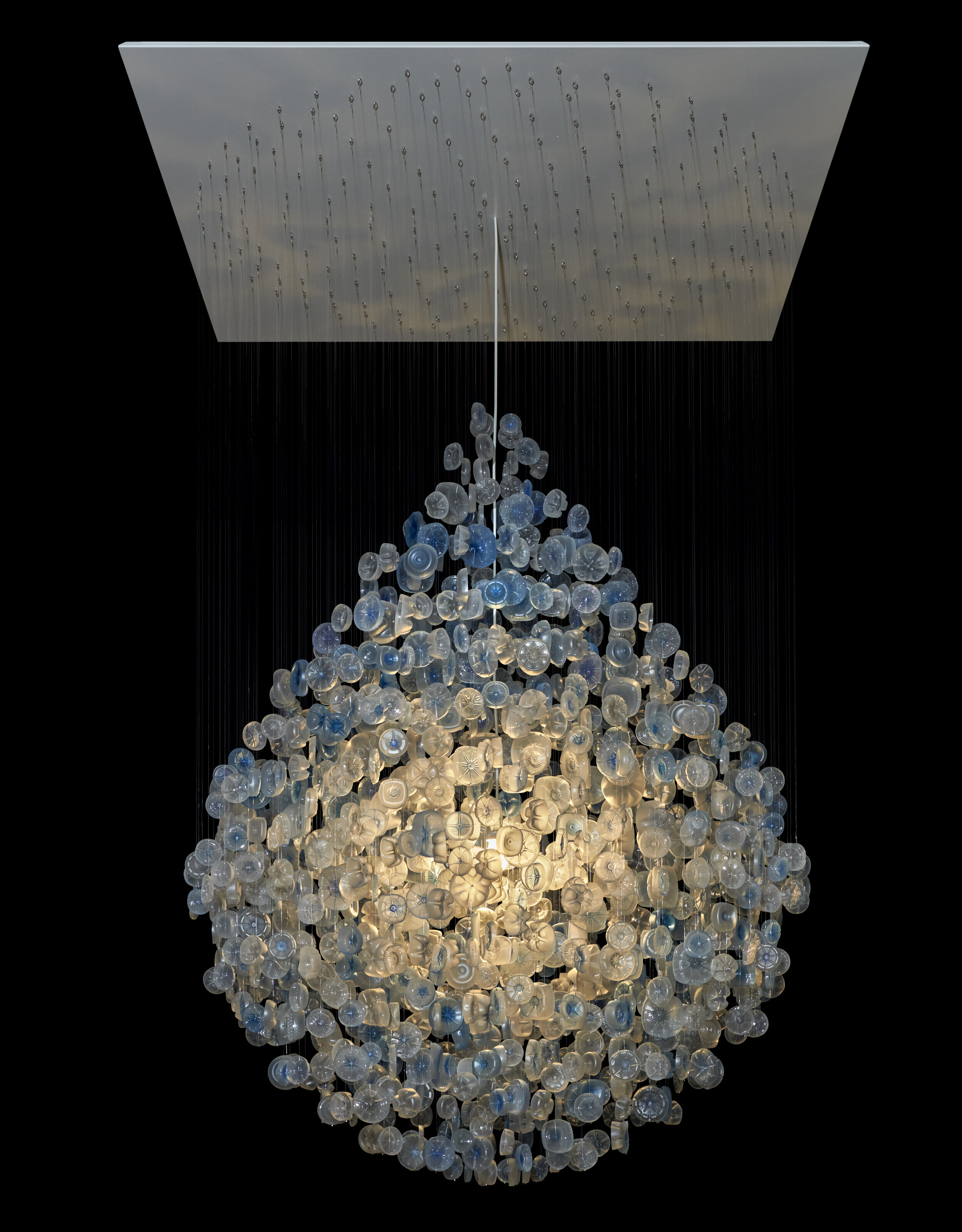 Stuart Haygarth, Drop, 2011. PET water containers, sand, monofilament line and painted MDF ceiling platform