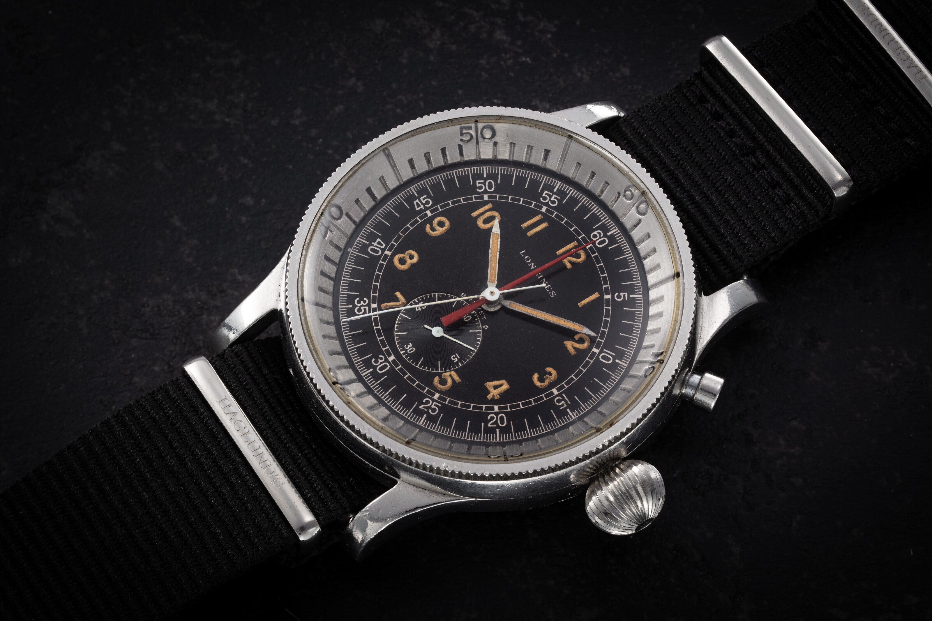 LONGINES REF. 5824 A RARE AND UNUSUAL STEEL SINGLE BUTTON FLYBACK CHRONOGRAPH WRISTWATCH