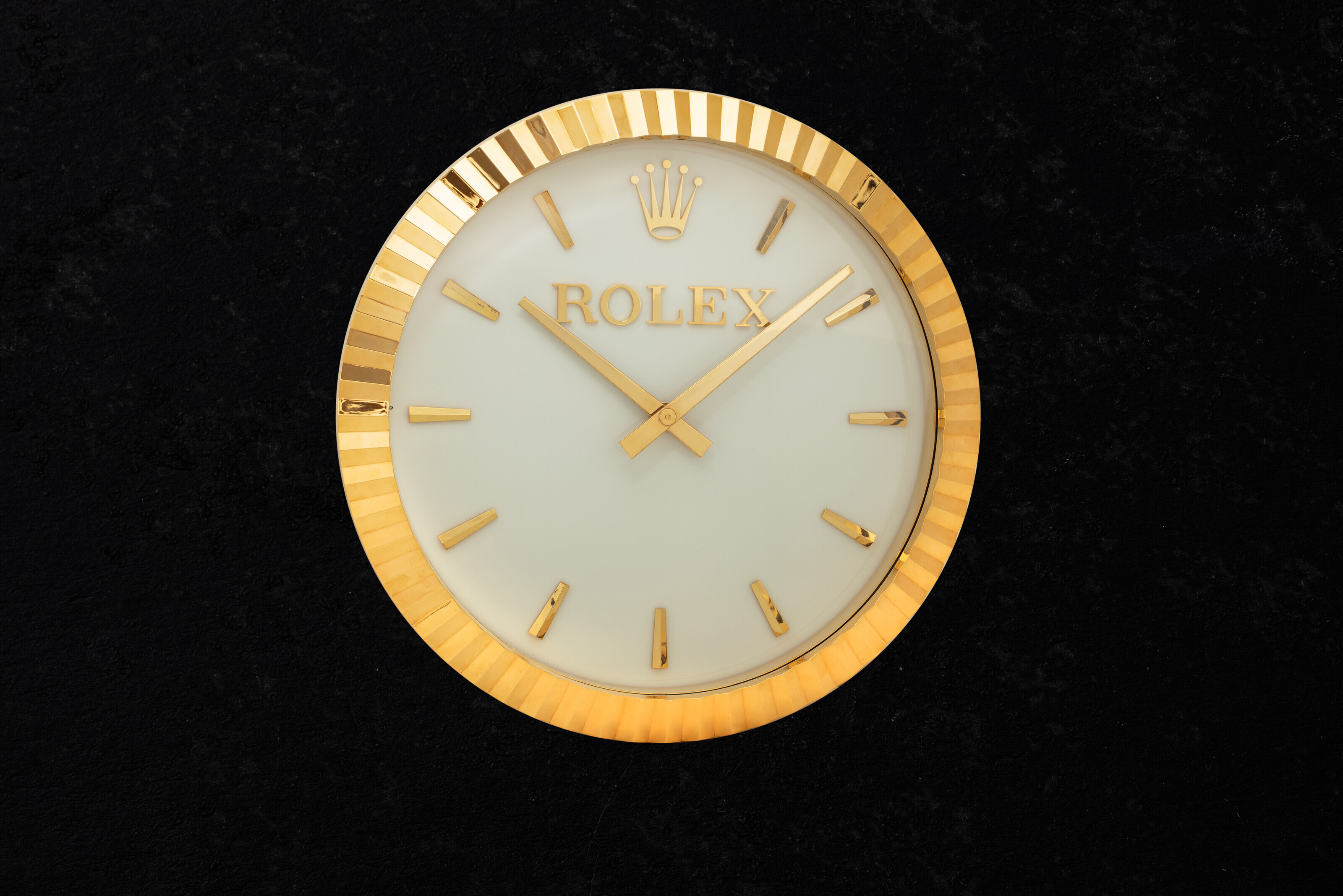 INDUCTA FOR ROLEX, A LARGE AND ATTRACTIVE GILT WALL CLOCK, Christie’s