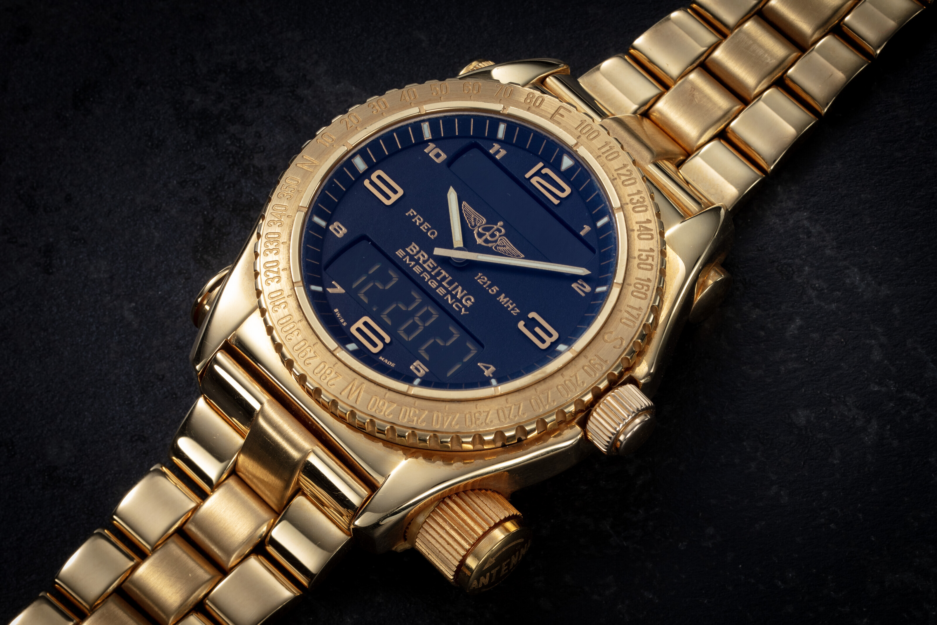 BREITLING, EMERGENCY, A LIMITED EDITION GOLD WRISTWATCH WITH