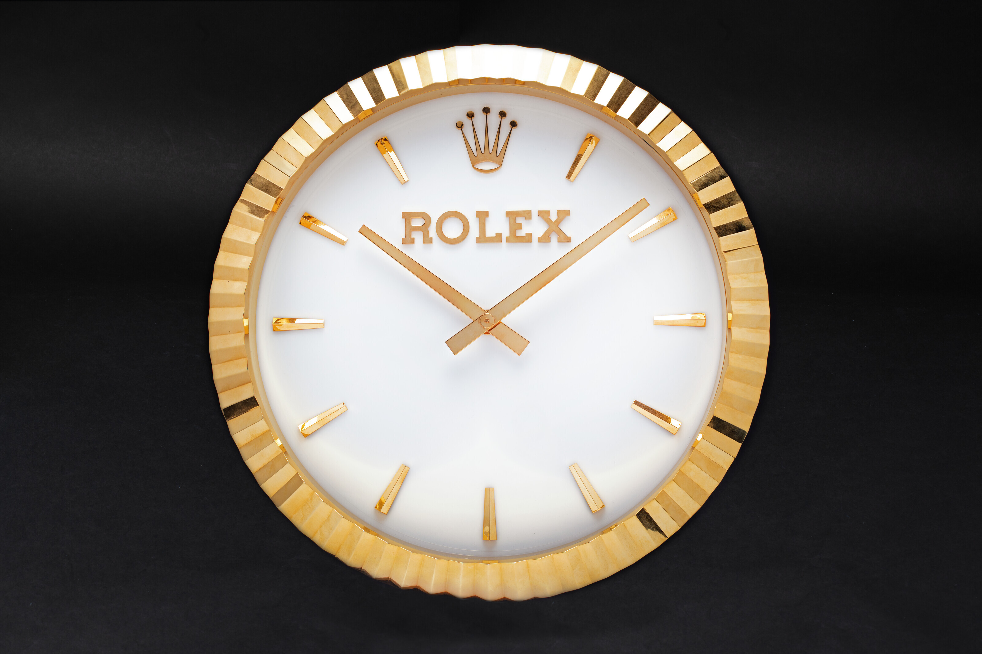 INDUCTA FOR ROLEX, A LARGE AND ATTRACTIVE GILT WALL CLOCK, Christie’s