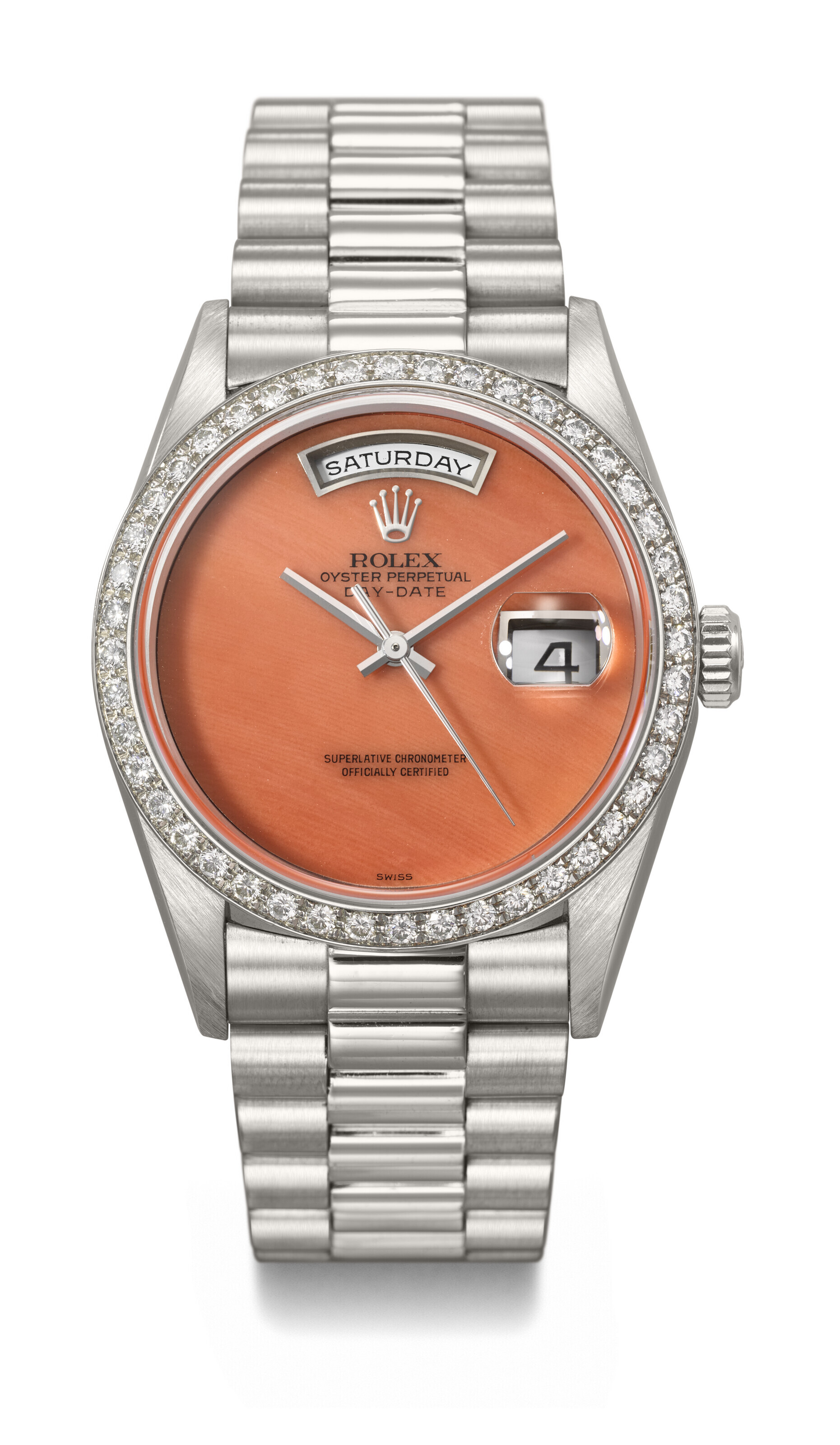 Rolex. A platinum and diamond-set automatic wristwatch with sweep centre seconds, day, date, coral dial and bracelet, circa 1995. Day-Date model, ref. 18346, case no. W071074. Sold for CHF 327,600 on 13 May 2023 at Christie's in Geneva