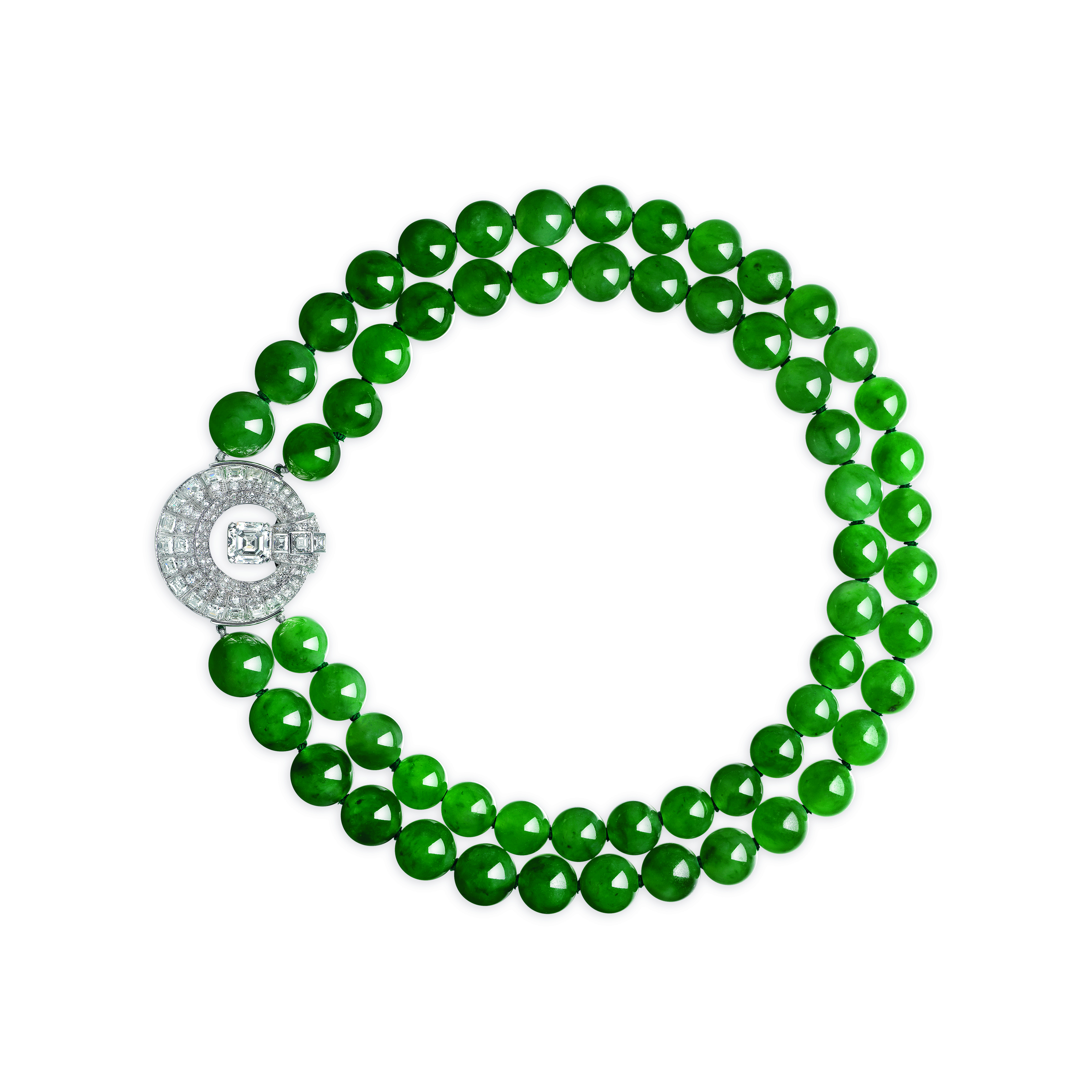 A superb two-strand jadeite and diamond necklace. Two strands of sixty jadeite beads measuring approximately from 14.60 to 11.70 mm, square-shaped and round diamonds, 18k white gold, clasp detachable and wearable as a brooch, clasp signed Cartier, numbered. Size/dimensions: 40.2 cm shortest strand; clasp-brooch 3.7 cm. Sold for CHF1,618,000 on 10 May 2023 at Christie’s in Geneva