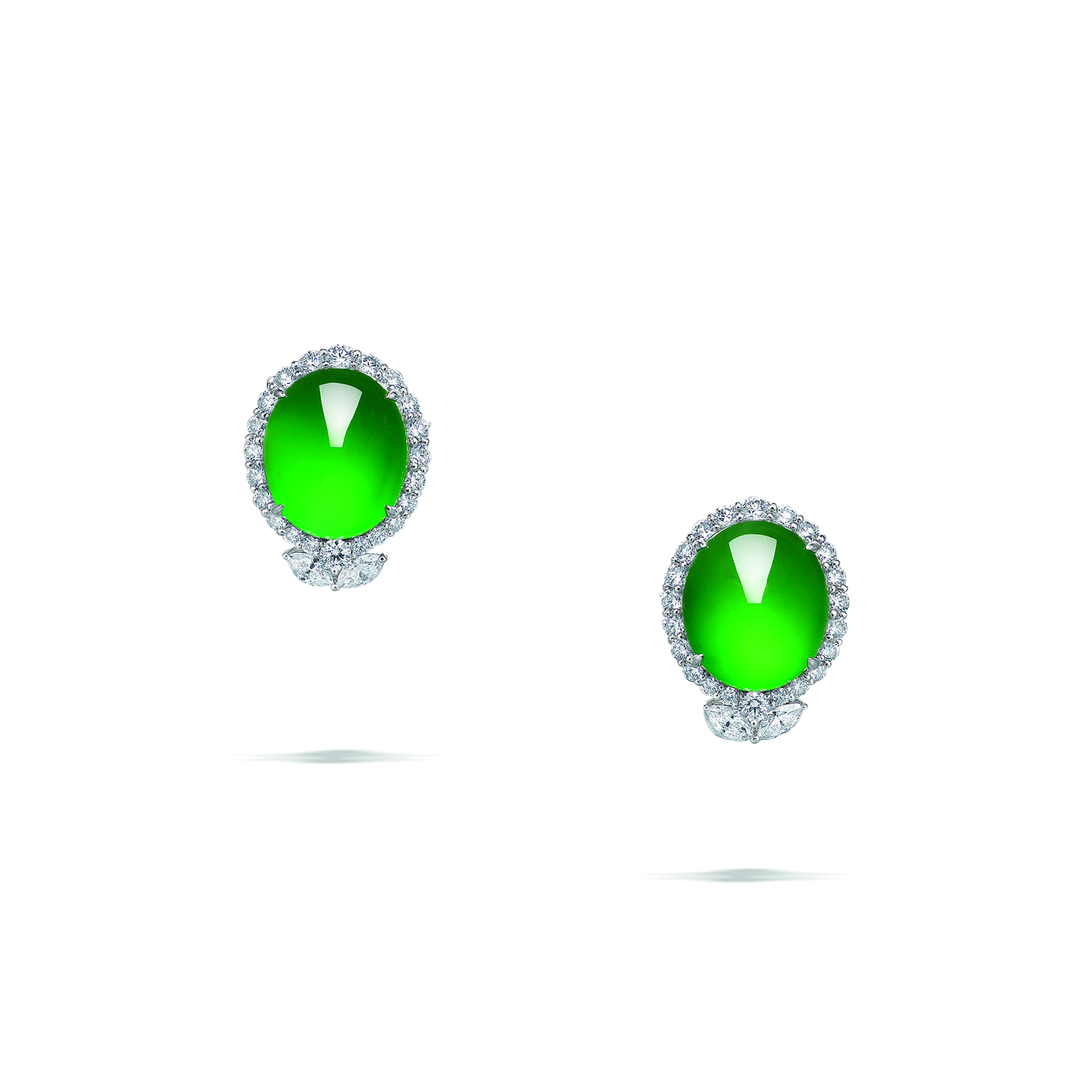 A pair of jadeite and diamond earrings. Oval jadeite cabochons, the largest measuring approximately 18.80 x 16.10 x 8.60 mm, marquise-shaped and round diamonds, 18k white gold. Size/dimensions: 2.7 cm. Sold for CHF378,000 on 10 May 2023 at Christie’s in Geneva