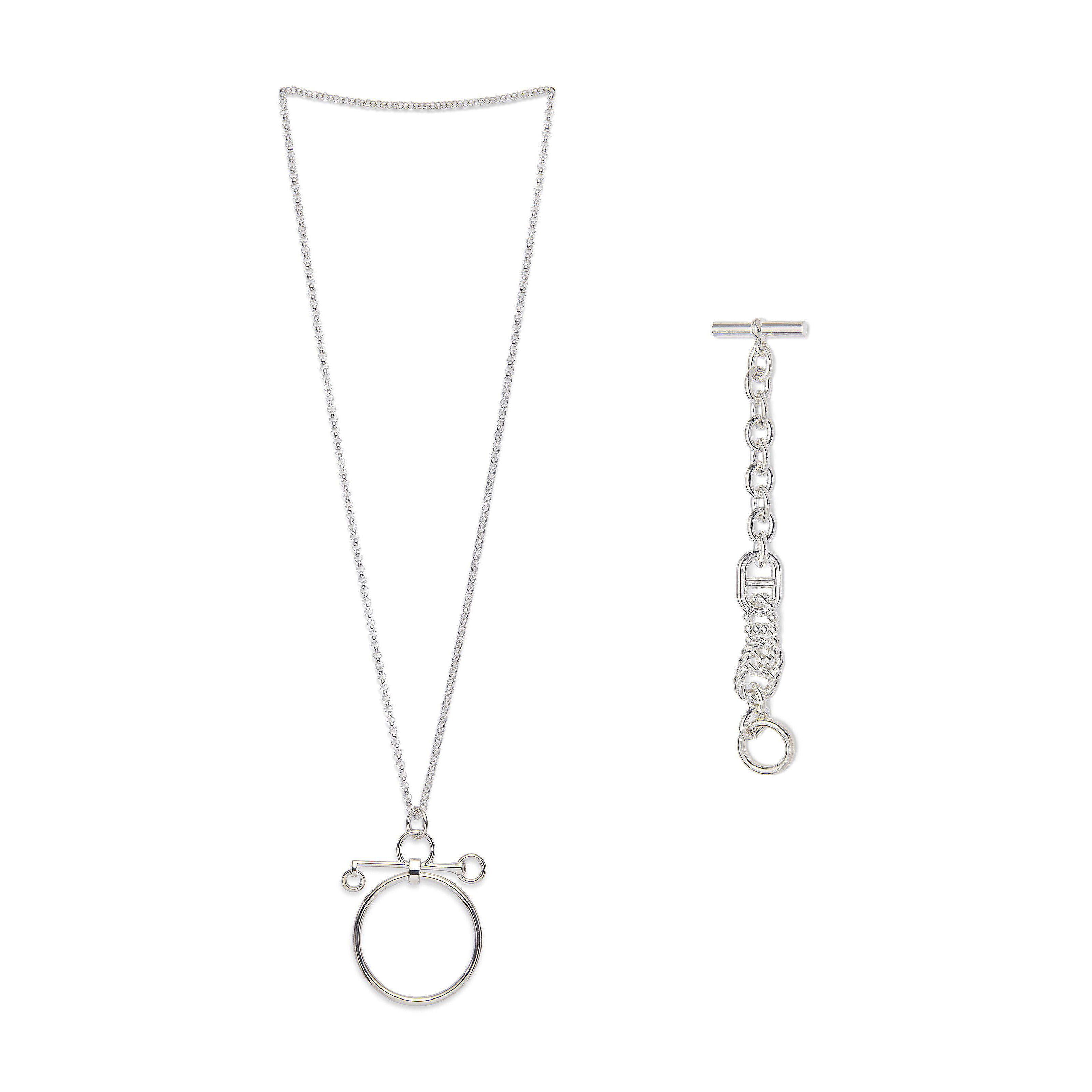 A SET OF TWO: A STERLING SILVER MORS DE BRIDE PENDANT & A STERLING 