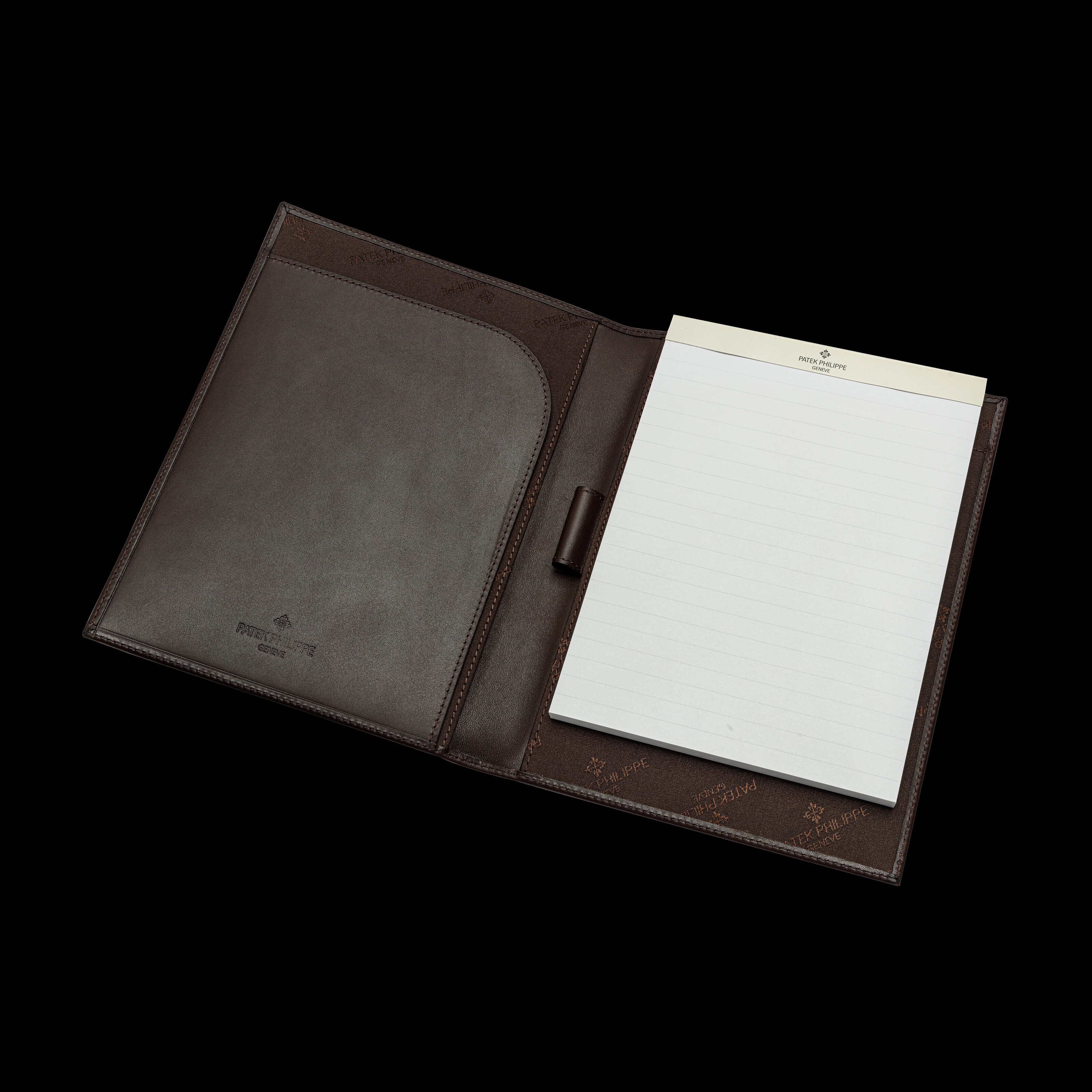 PATEK PHILIPPE, TWO PAIRS OF GLOVES, PEN HOLDER, NOTEPAD AND