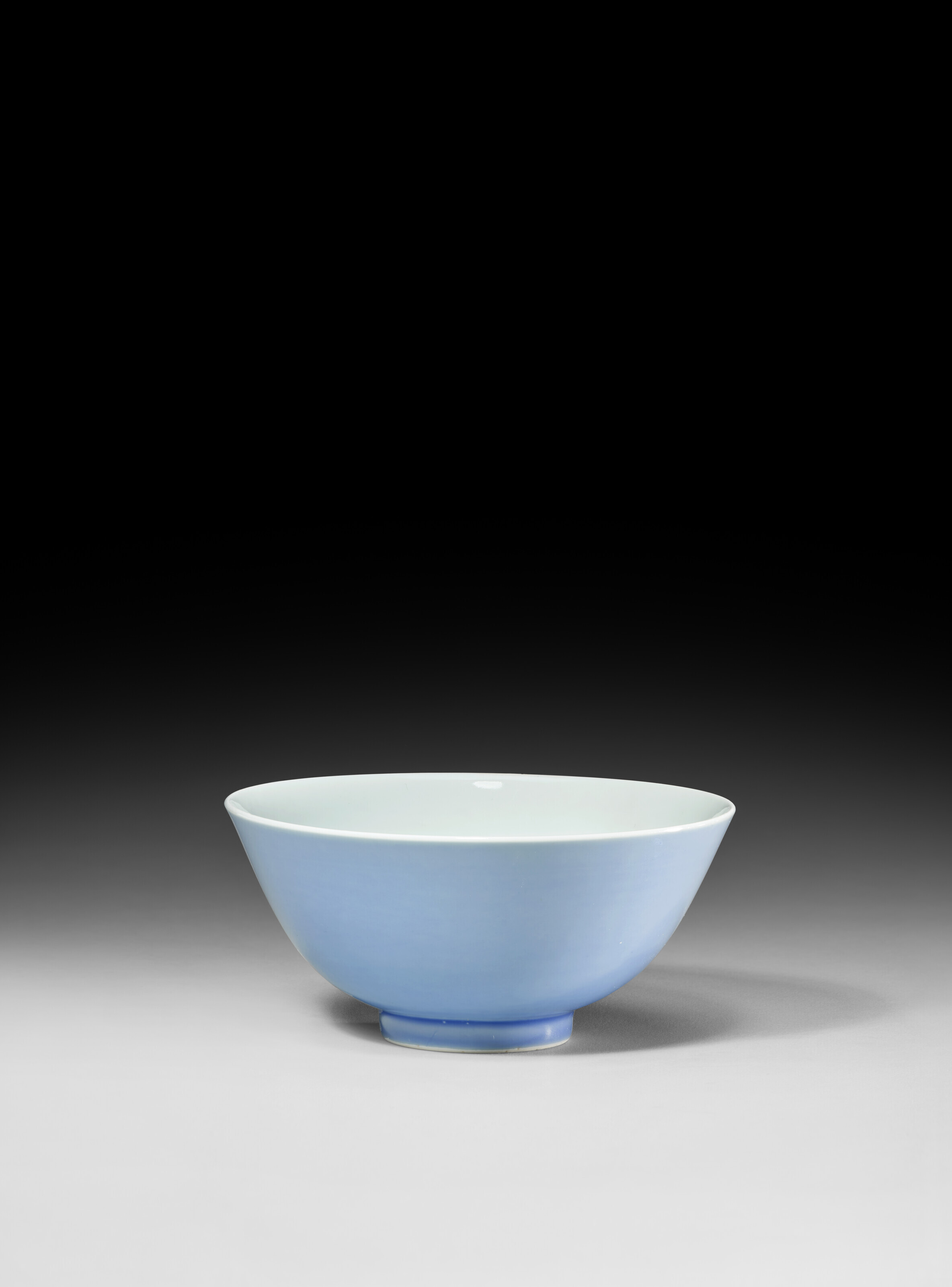 A LAVENDER-BLUE-GLAZED BOWL, YONGZHENG SIX-CHARACTER MARK IN UNDERGLAZE BLUE WITHIN A DOUBLE CIRCLE AND OF THE PERIOD (1723-1735)... 