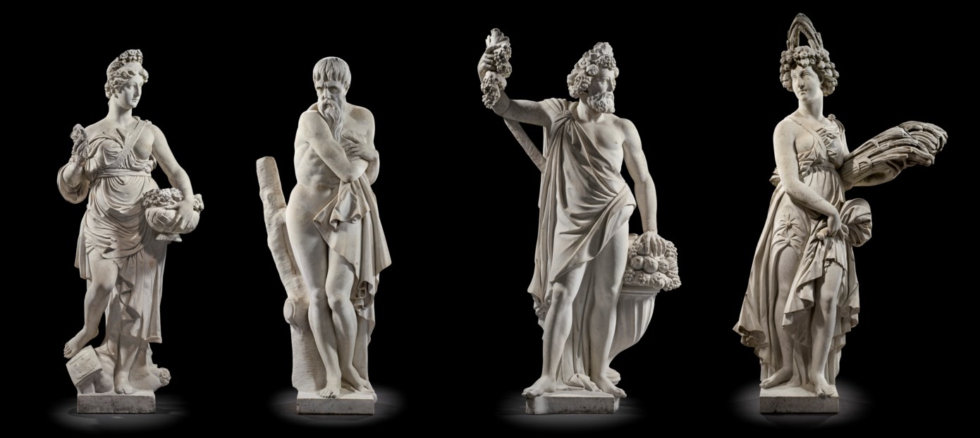 A GROUP OF FOUR OVER-LIFESIZE MARBLE FIGURES OF THE FOUR SEASONS