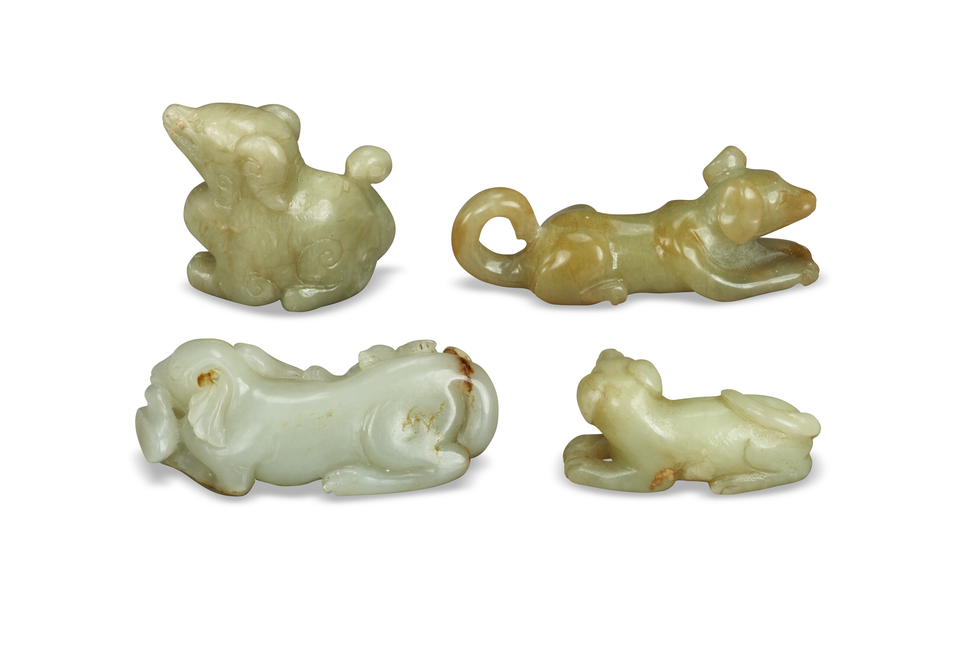 FOUR JADE CARVINGS OF DOGS, CHINA, LATE QING DYNASTY OR LATER