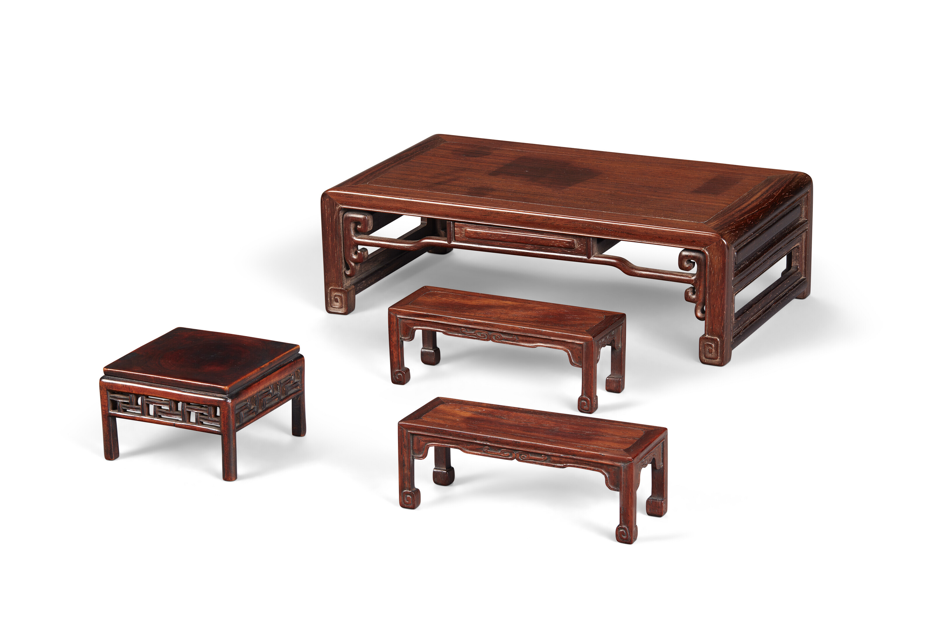 FOUR MINIATURE CARVED FURNITUREFORM STANDS, CHINA, 17TH19TH CENTURY