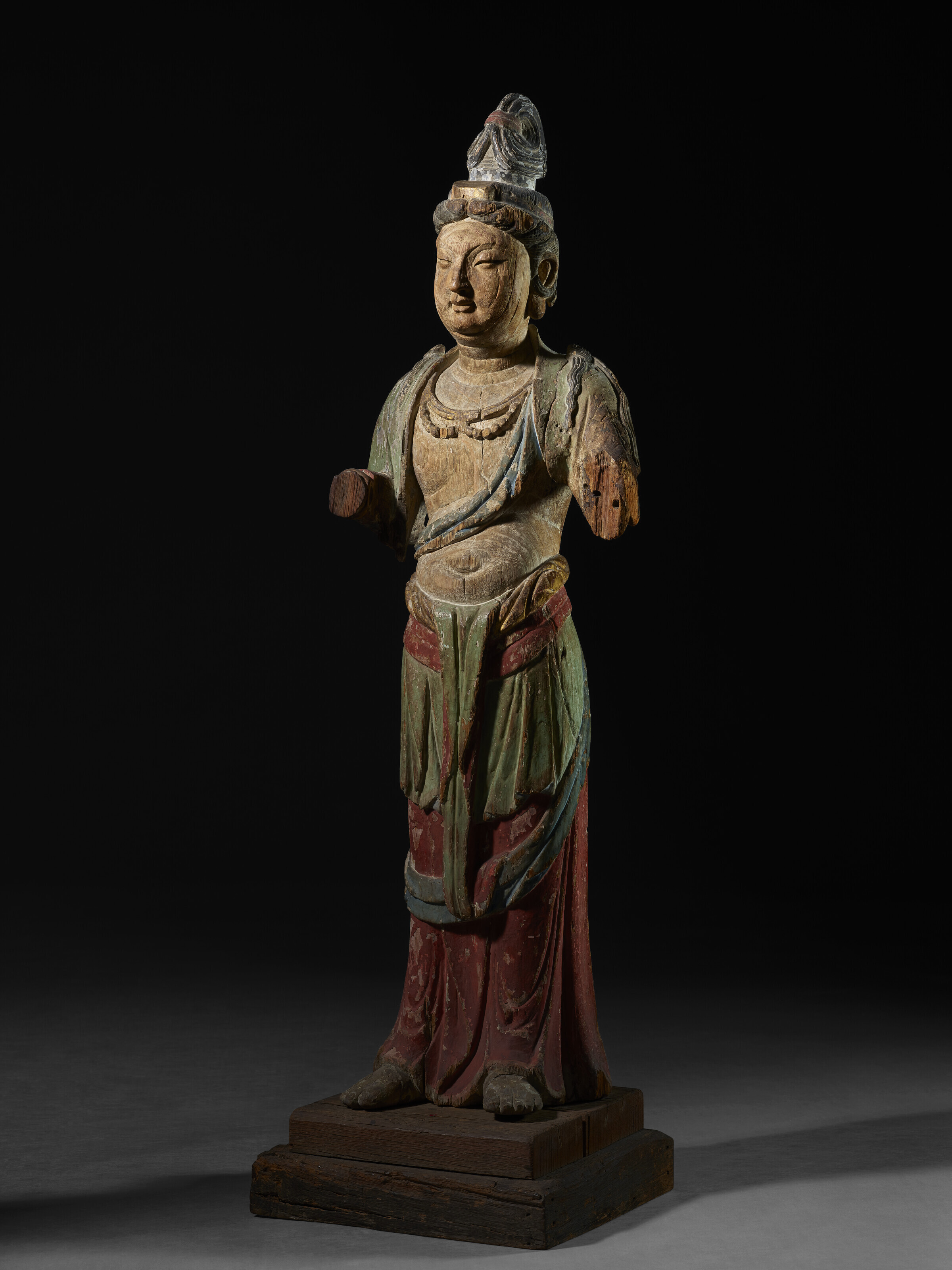 A RARE PAINTED WOOD FIGURE OF A STANDING BODHISATTVA, JIN DYNASTY