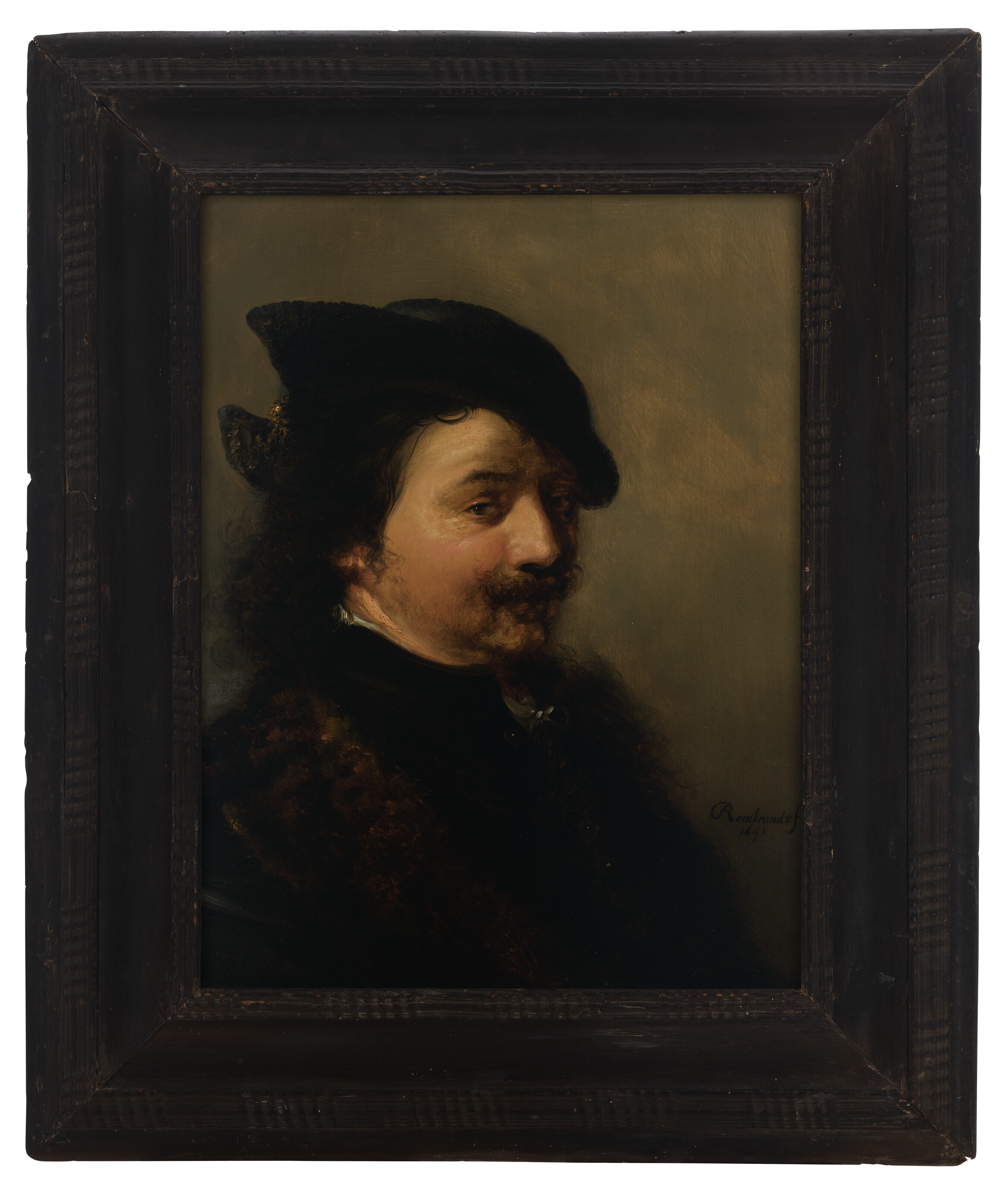 Portrait of a man, bust-length, in a black hat