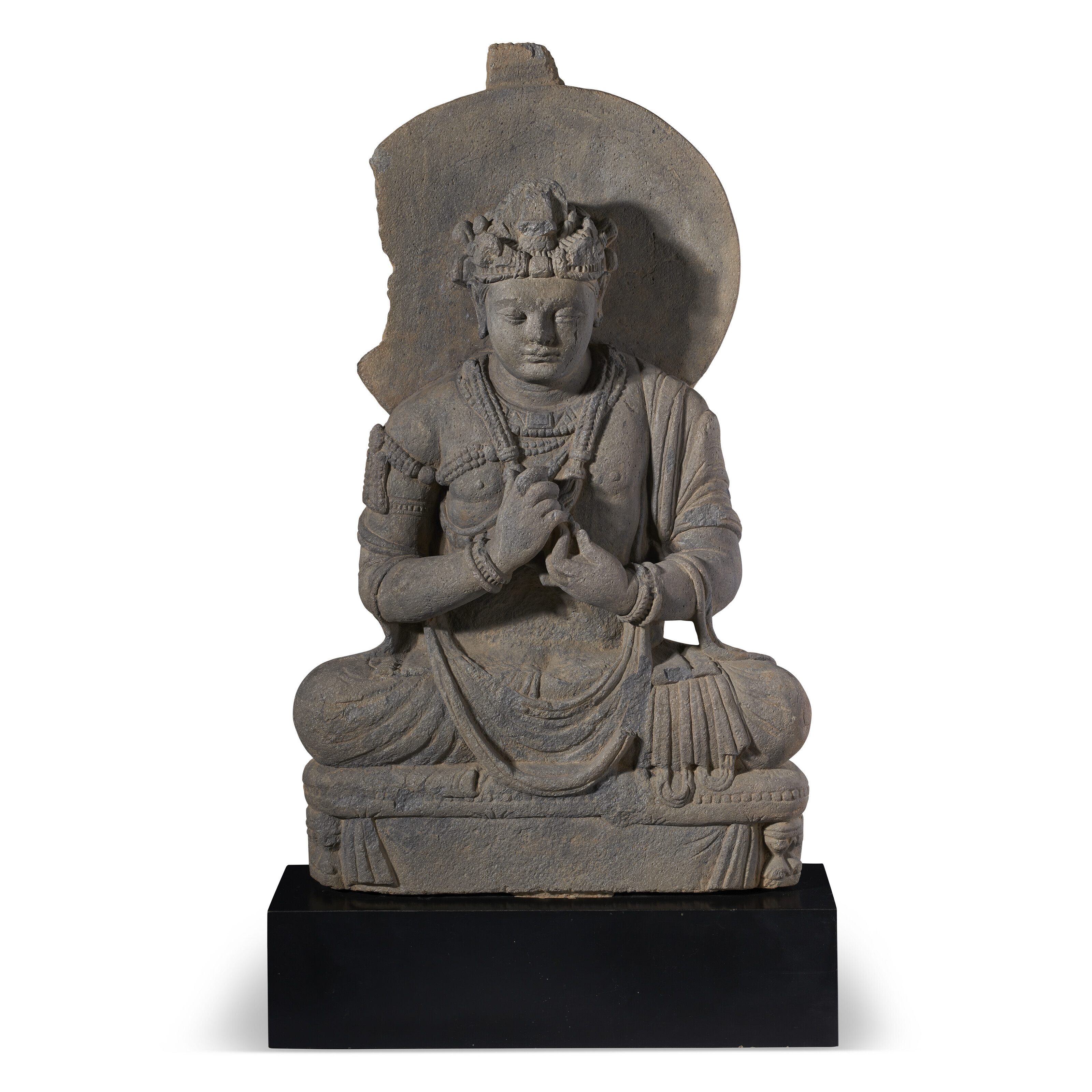 A GREY SCHIST FIGURE OF A SEATED BODHISATTVA, ANCIENT REGION OF ...