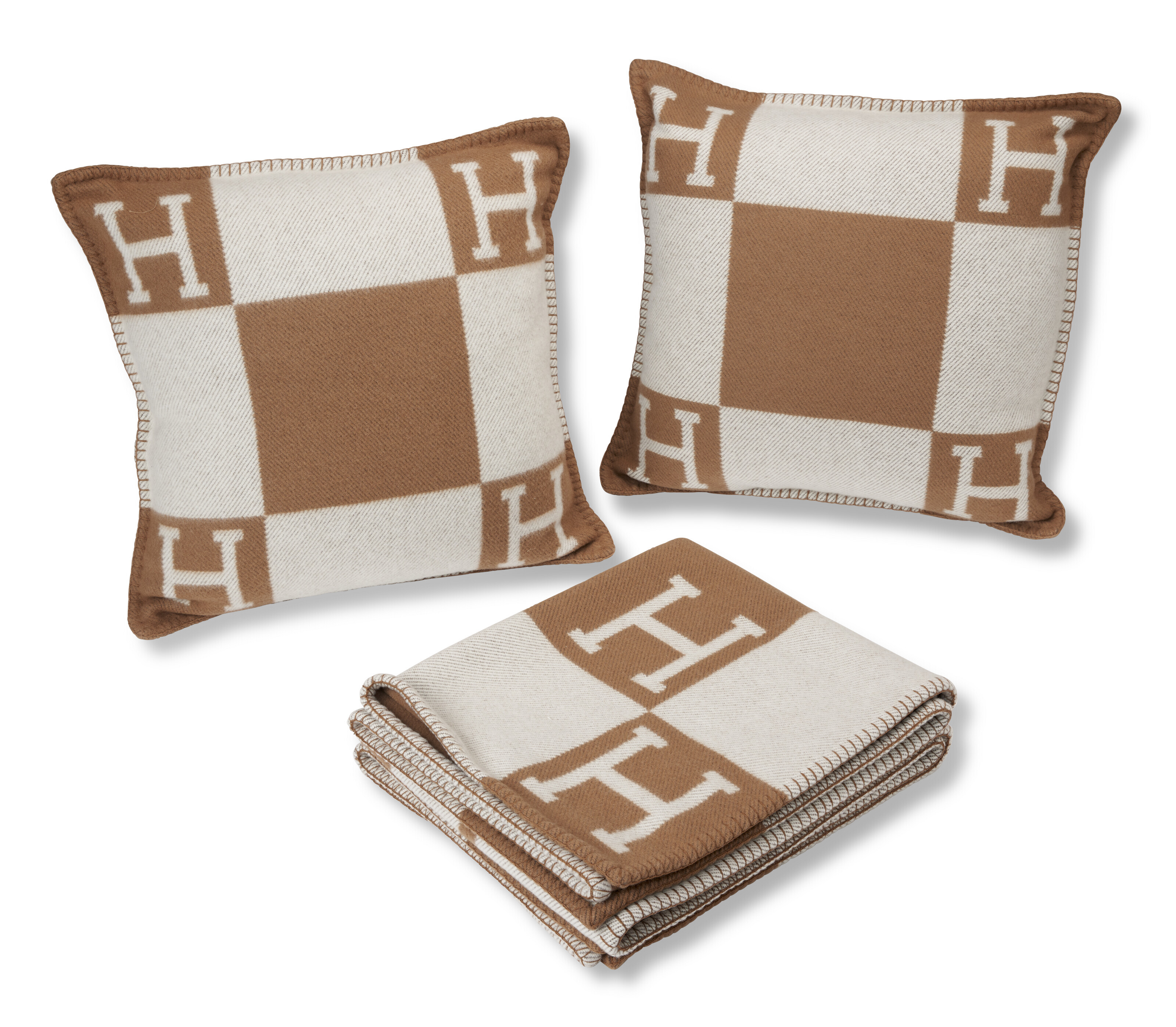 A SET OF THREE TWO GOLD CASHMERE & WOOL AVALON PILLOWS AND A GOLD CASHMERE & WOOL AVALON THROW