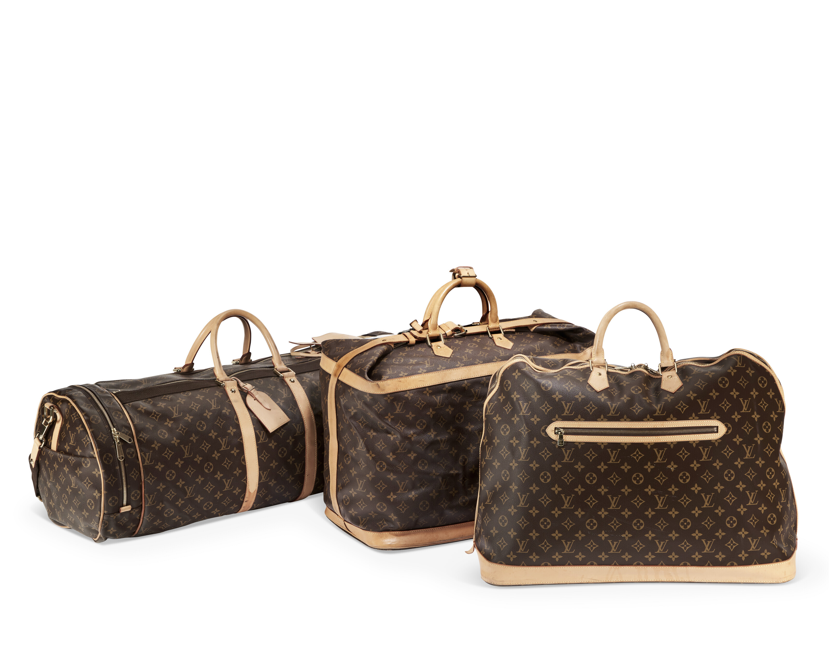 A SET OF THREE BROWN MONOGRAM CANVAS TRAVEL BAGS LOUIS VUITTON