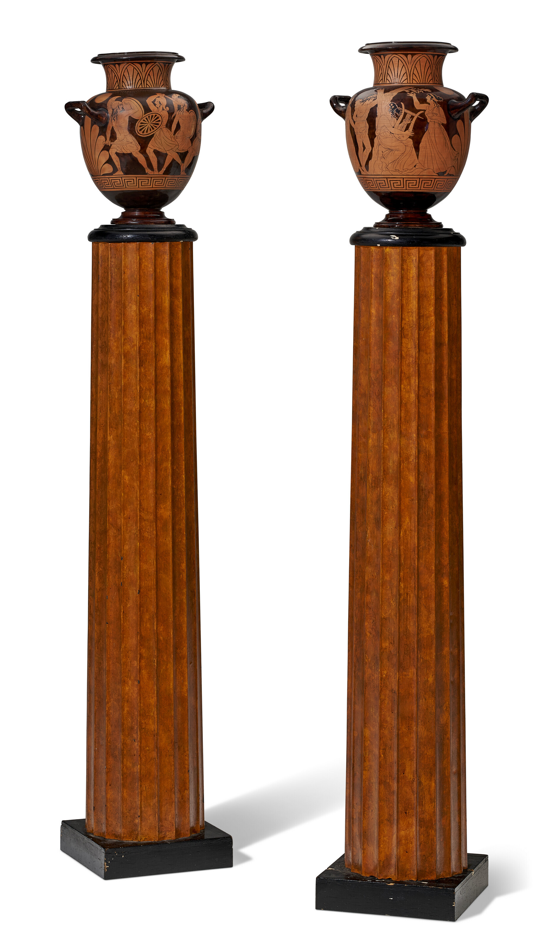 A PAIR OF ETRUSCAN STYLE TERRACOTTA URNS ON FLUTED TOLE PEDESTALS, THE