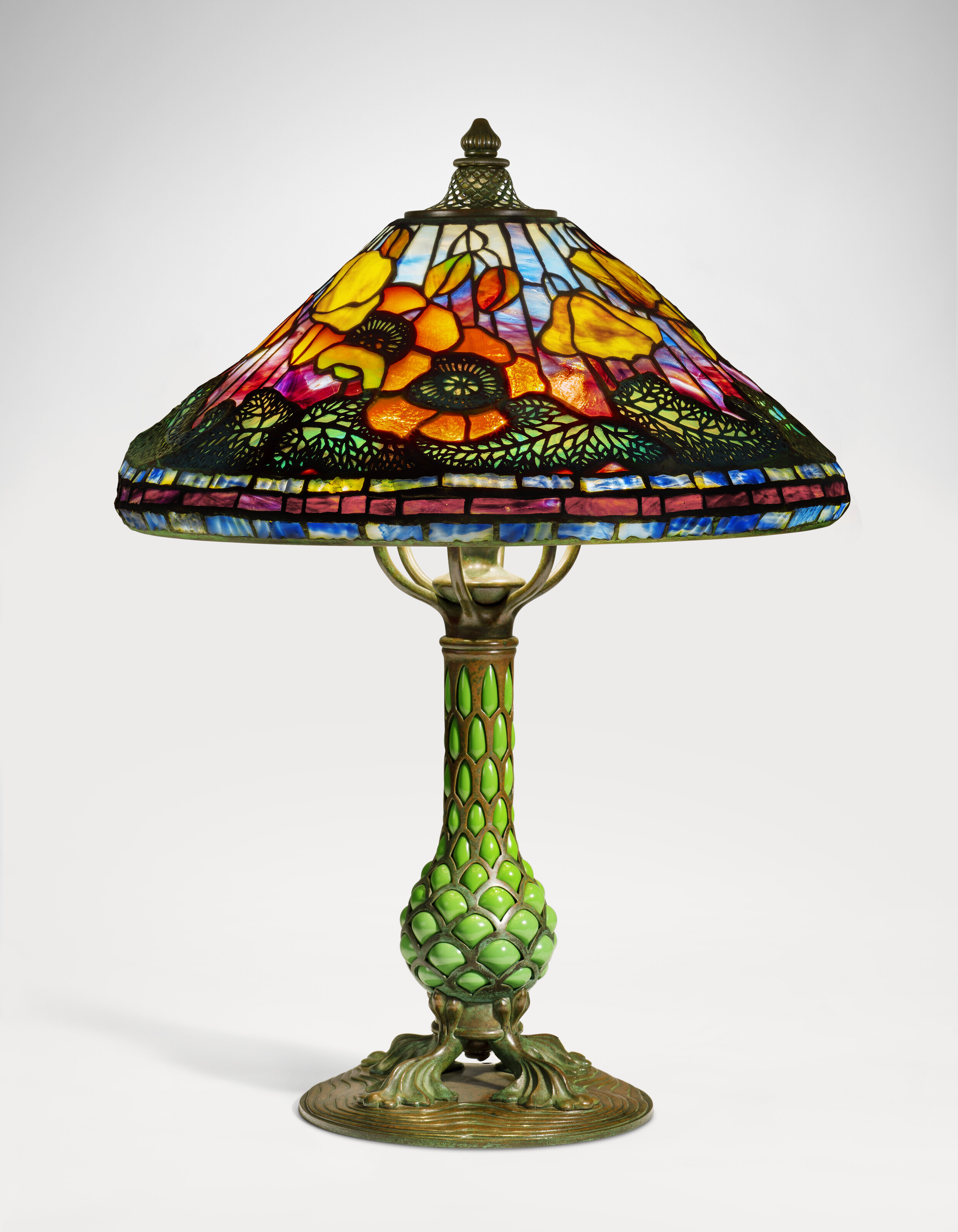 Tiffany Studios, 'Poppy' Table Lamp, c. 1905. Leaded glass, Favrile glass, patinated bronze. 23 in (58.4 cm) high, 17 in (43.2 cm) diameter of shade. Sold for $163,800 on 14 June 2023 at Christie's in New York