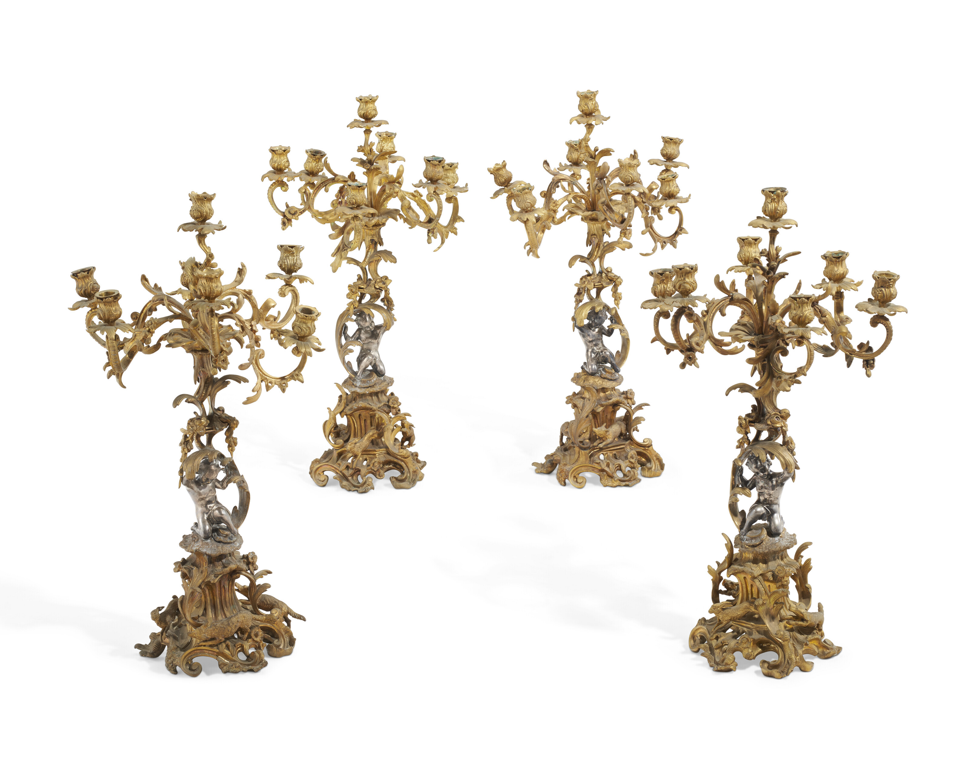 A SET OF FOUR NAPOLEON III GILT AND SILVERED-BRONZE SEVEN-LIGHT
