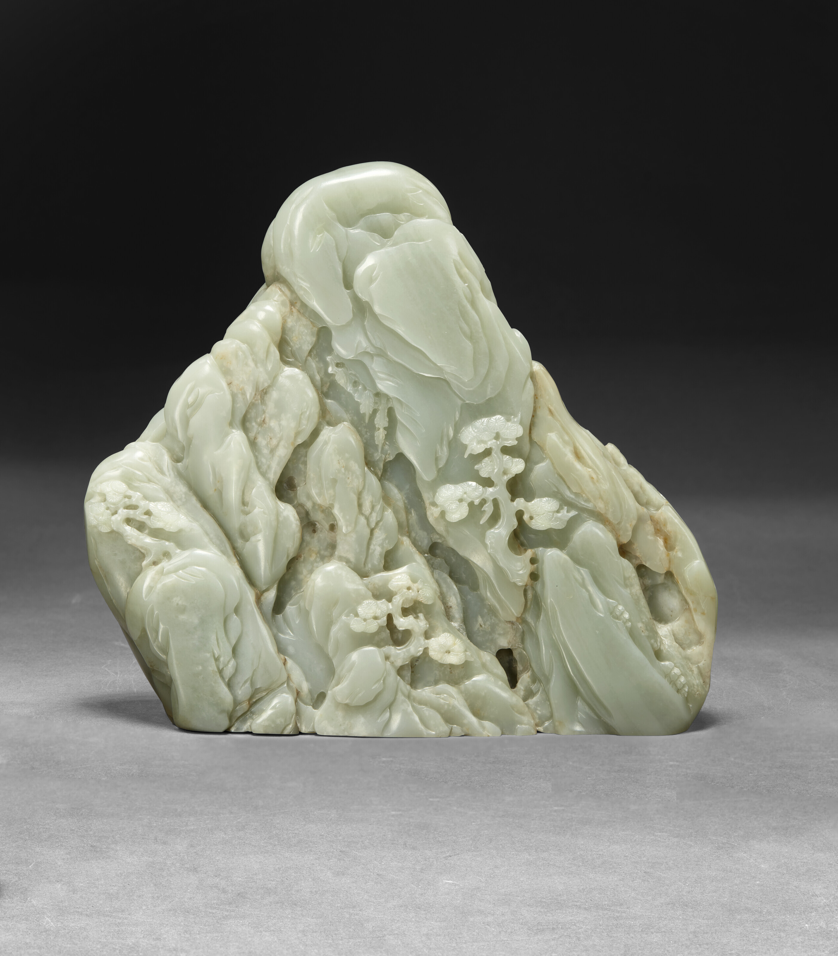 A LARGE PALE GREENISH-WHITE JADE 'DAOIST IMMORTALS' BOULDER, 18TH
