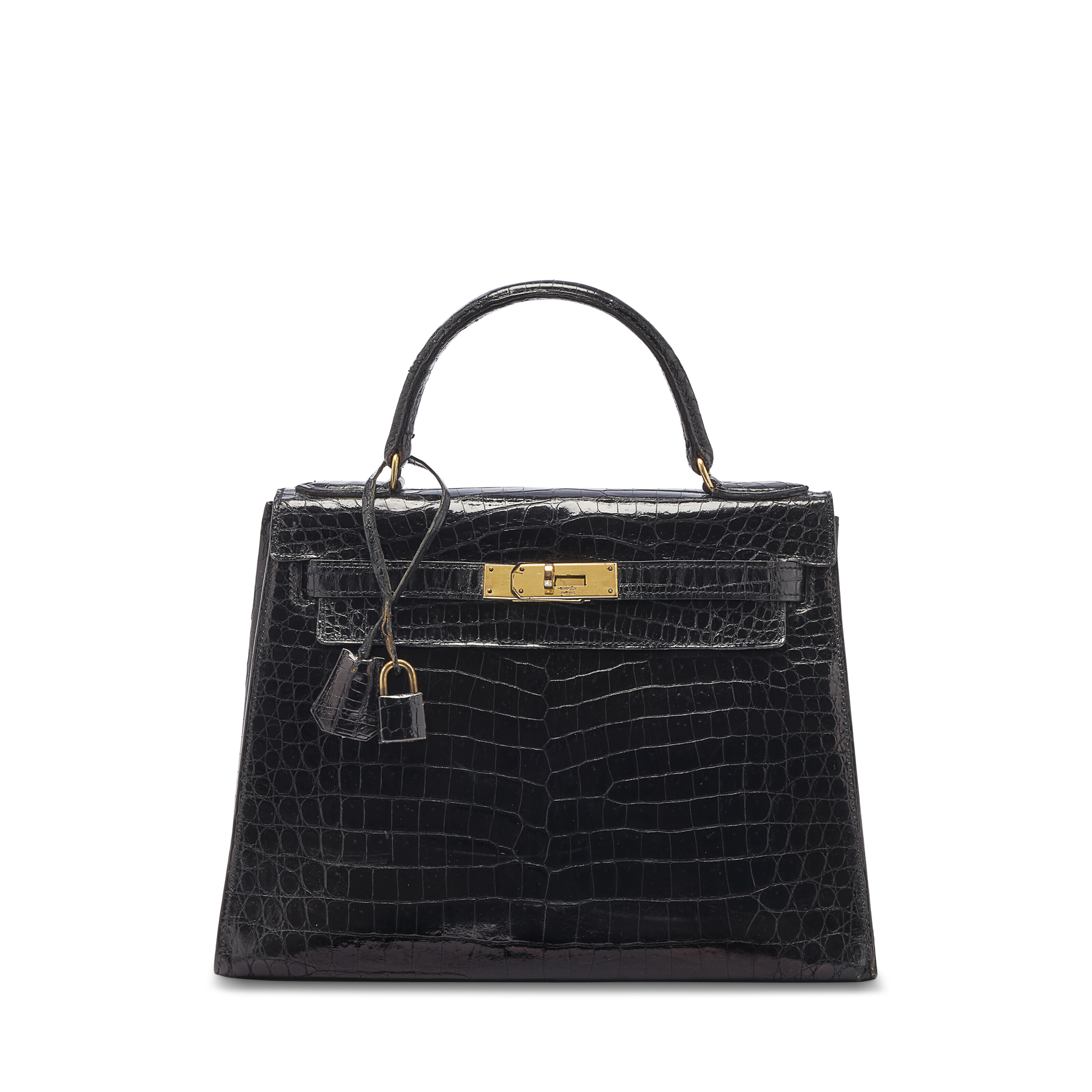 A SHINY BLACK POROSUS CROCODILE PIANO BAG WITH GOLD HARDWARE HERMES 1963 Christie s