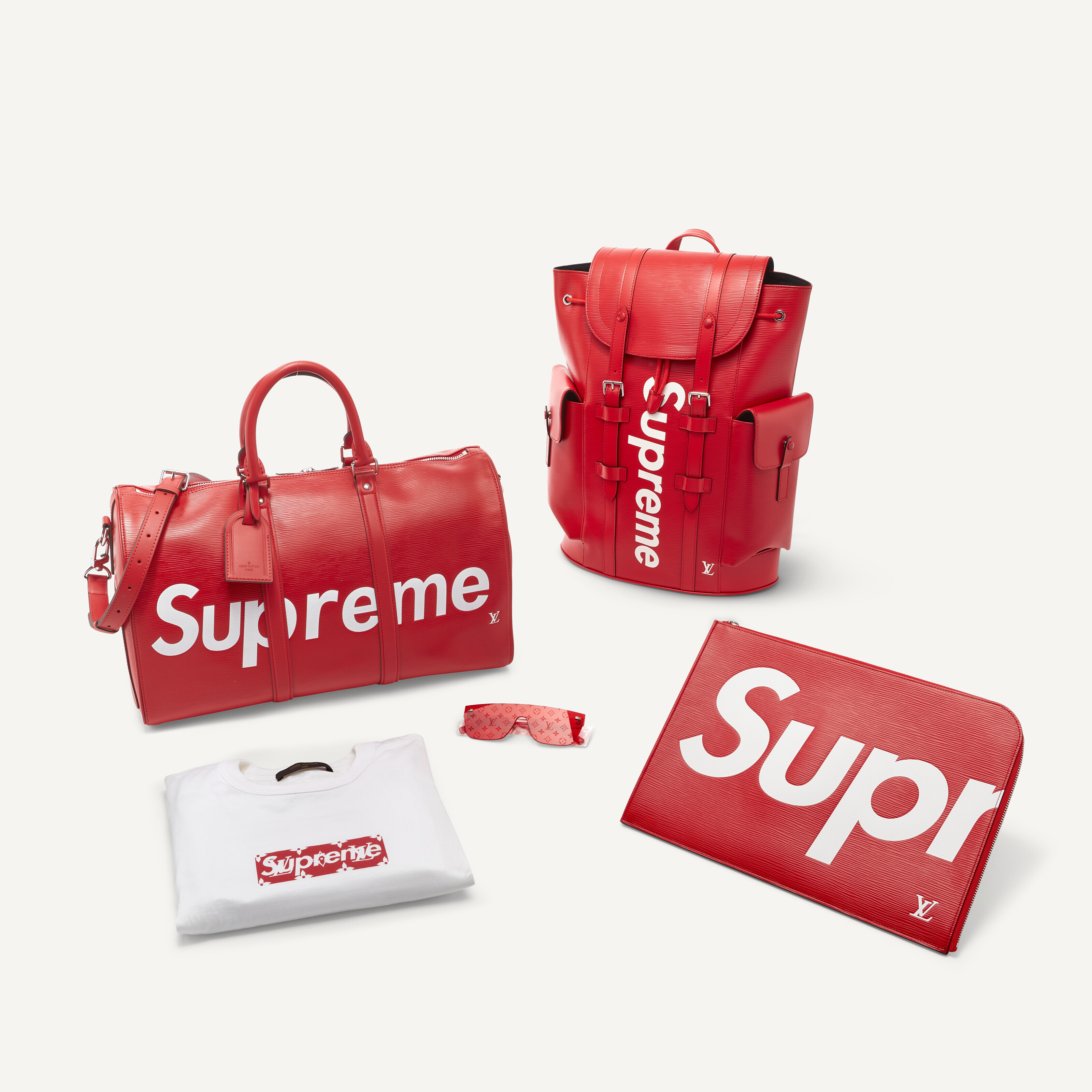 A GROUP OF FIVE : RED EPI LEATHER POUCH, A RED EPI LEATHER KEEPALL 50 ...